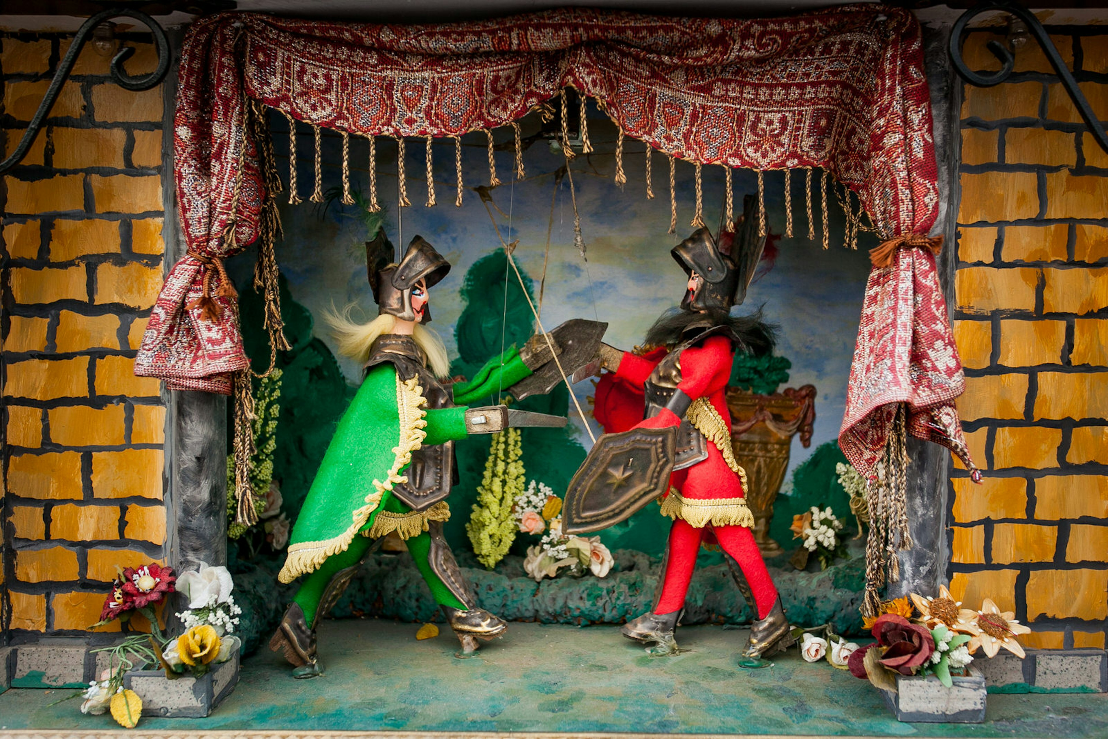 Knight puppets do battle in a traditional theatre