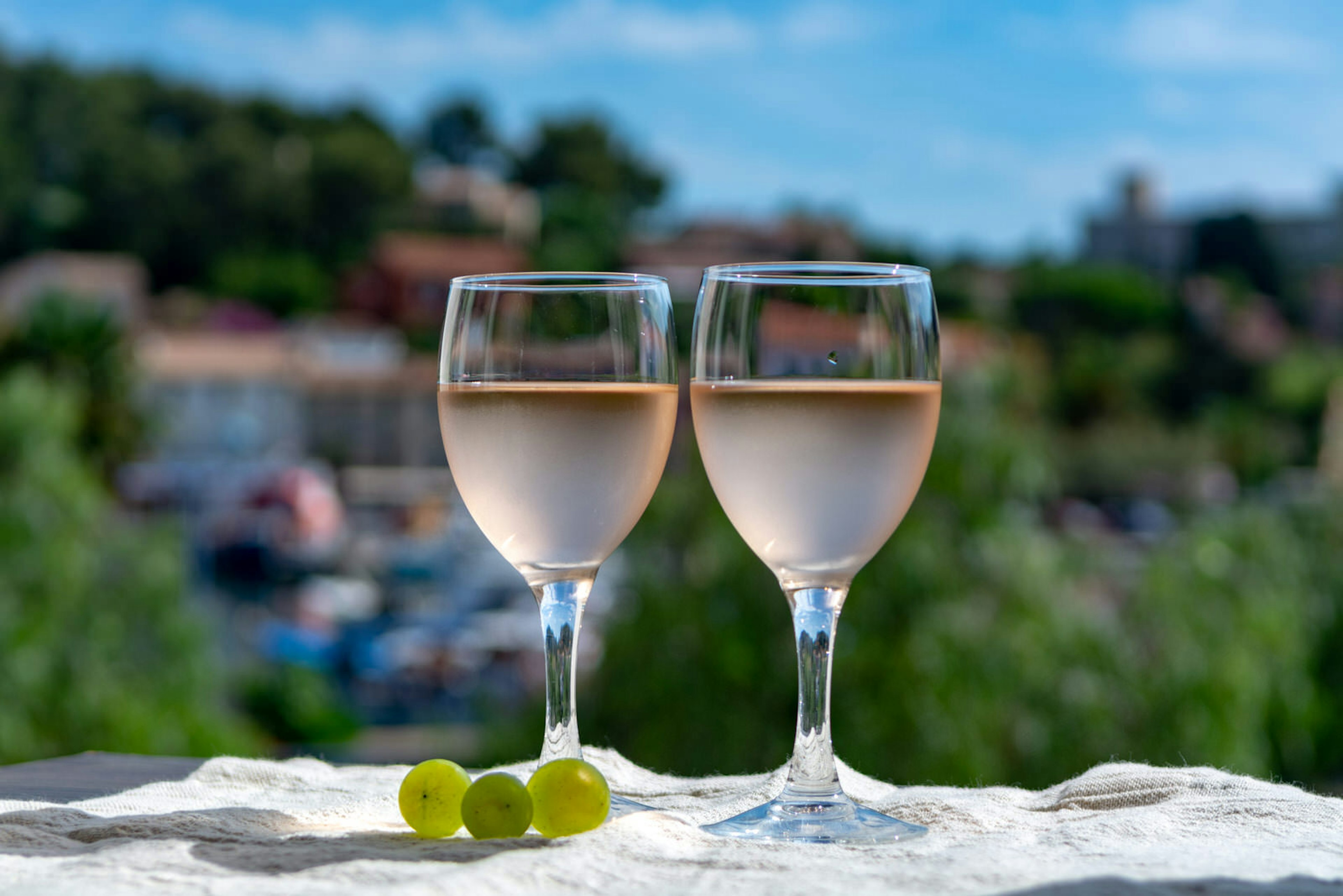 Two glasses of rosé wine served on an outdoor terrace