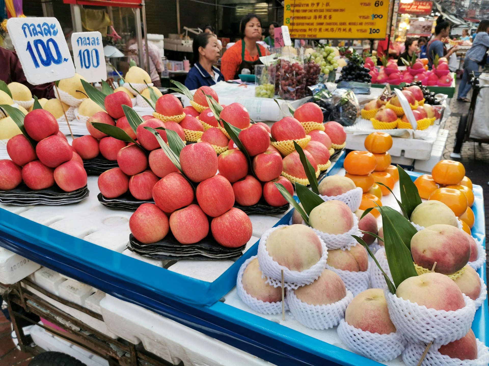 Red apples and other fresh fruits on display at Walking Street in China Town.