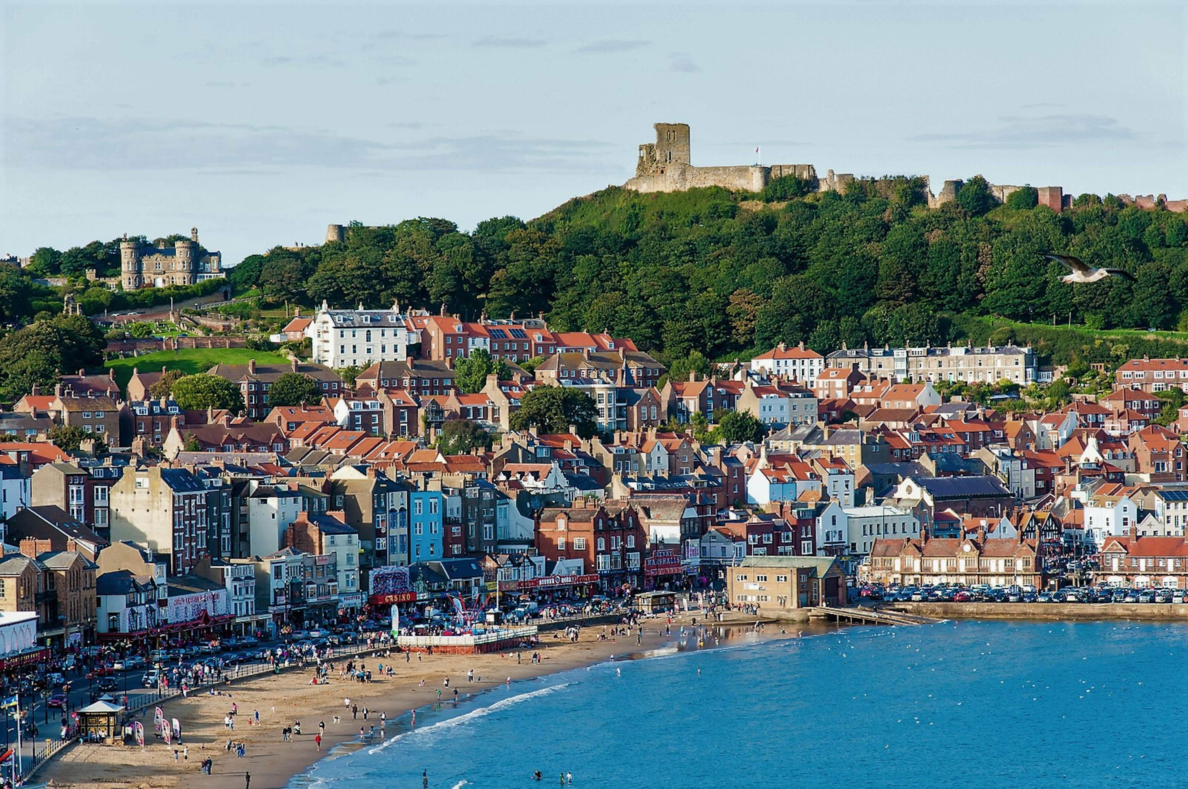 View of Scarborough beach with the town's castle on the hill above it