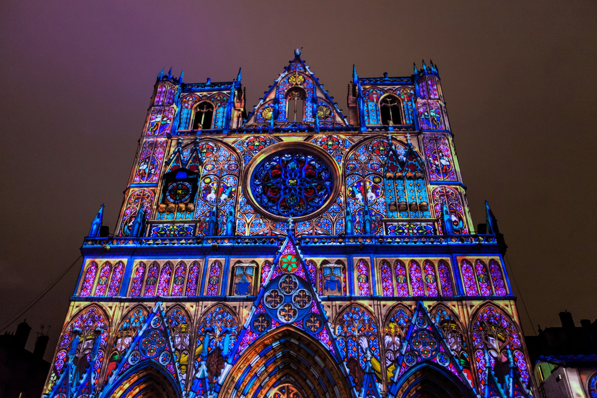 Exterior of Lyon Cathedral, a Roman Catholic cathedral dedicated to Saint John the Baptist, during the Lumiere light festival at night. 