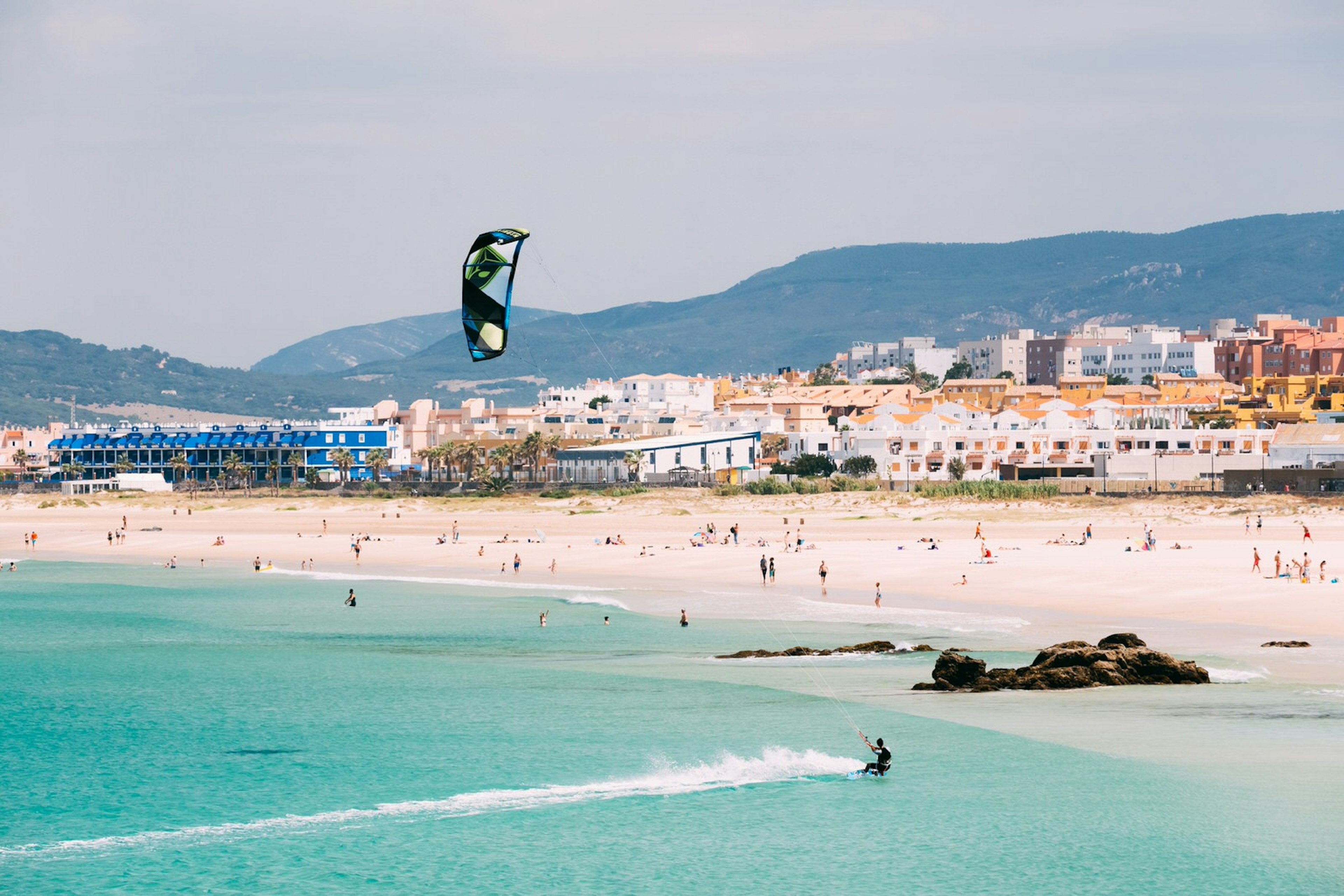 June 21, 2015: Kite surfing in Tarifa with beachgoers on the sand.
343840550
outdoor, coast, spain, travel, european, holiday, kite, active, summer, people, wave, rest, lifestyle, beach, surfing, spanish, blue, tourism, extreme, sea, scene, resort, beautiful, board, surf, water, man, vacation, europe, sport, landscape, ocean, kitesurf, watersport, kitesurfer, tarifa, kitesurfing, kiteboarding