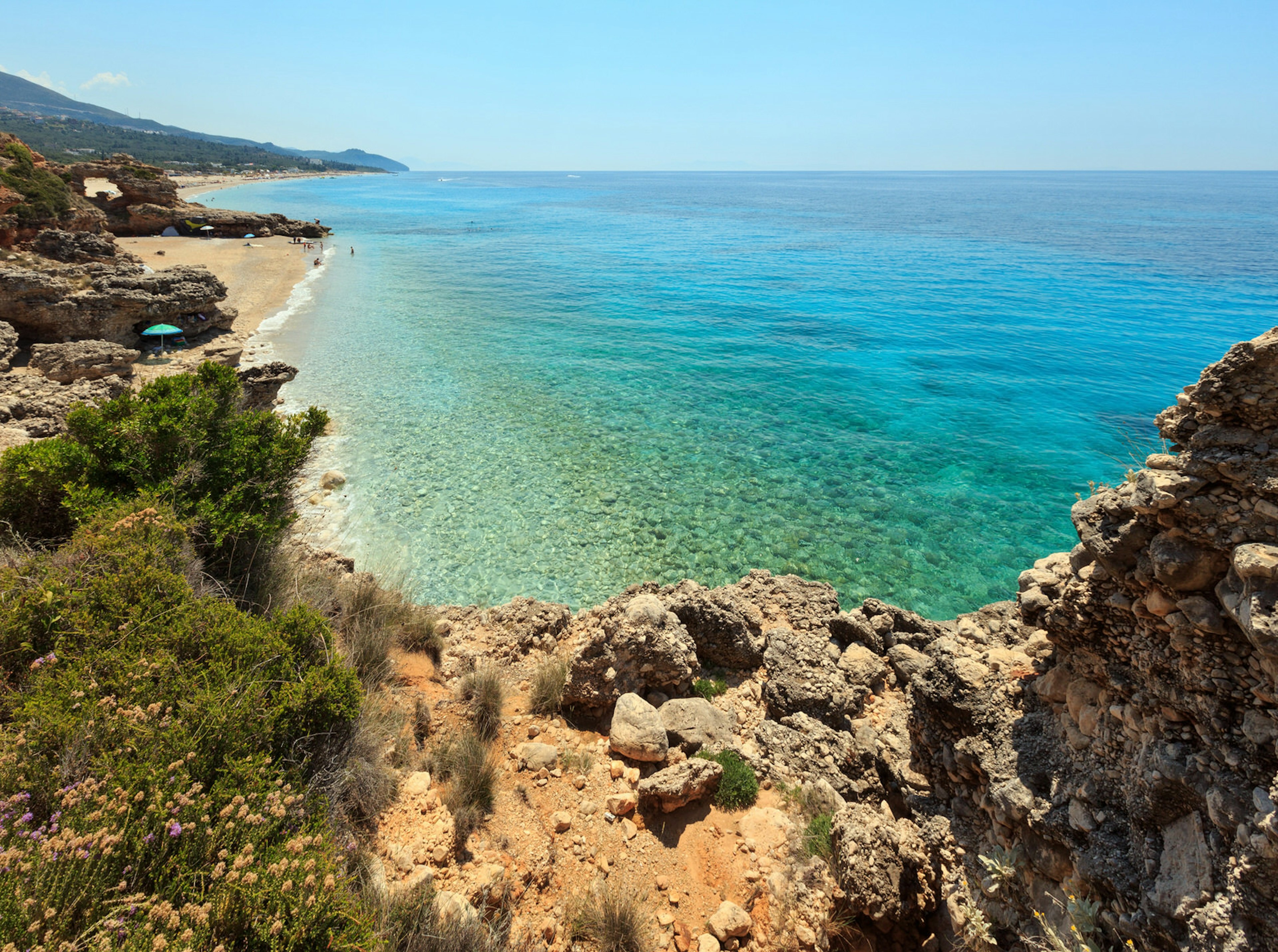 A high-angled shot of Dhërmi beach during summer with turquoise water