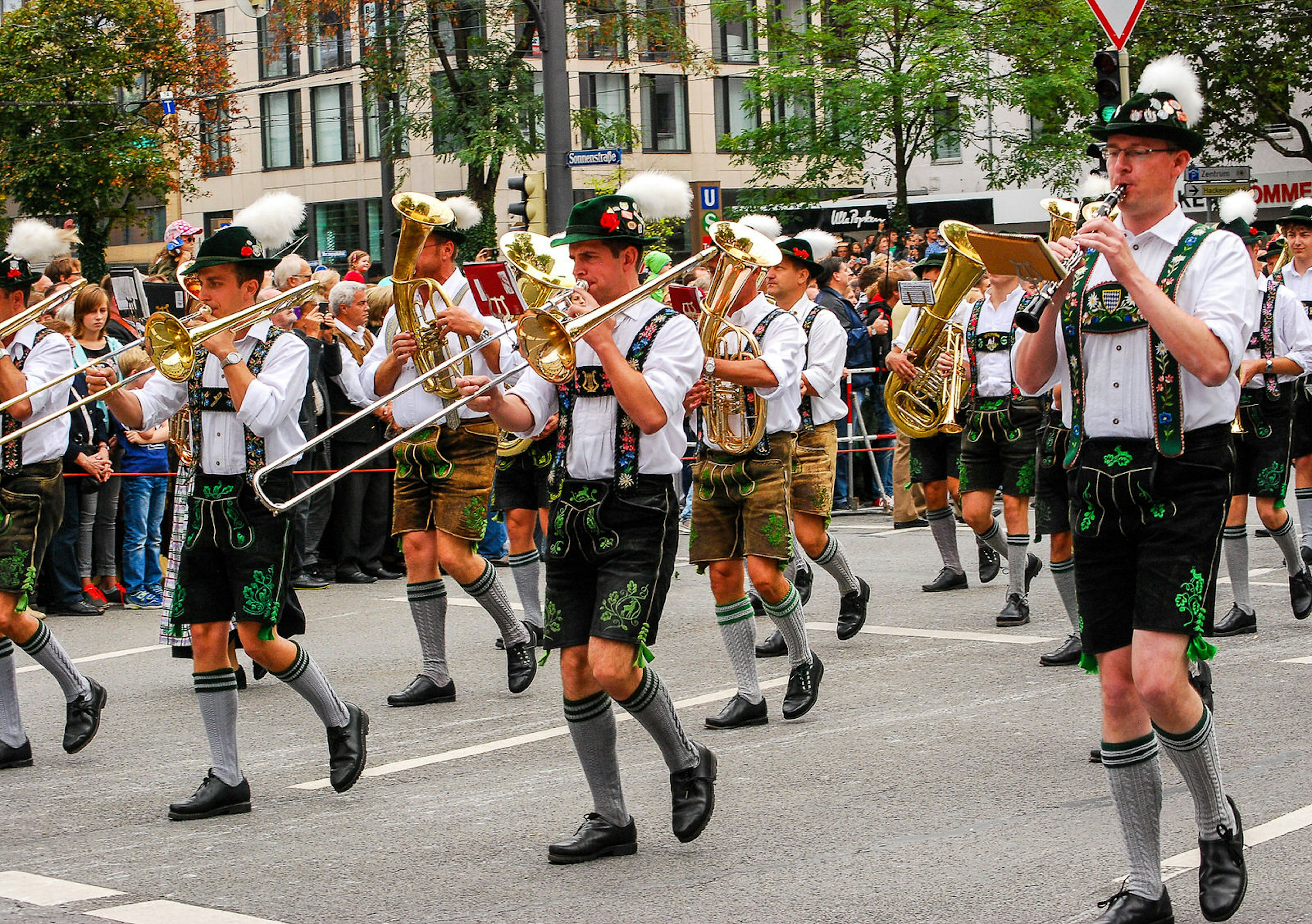 A marching band walks through the street during the Brewers' Parade at the start of Oktoberfest in Munich