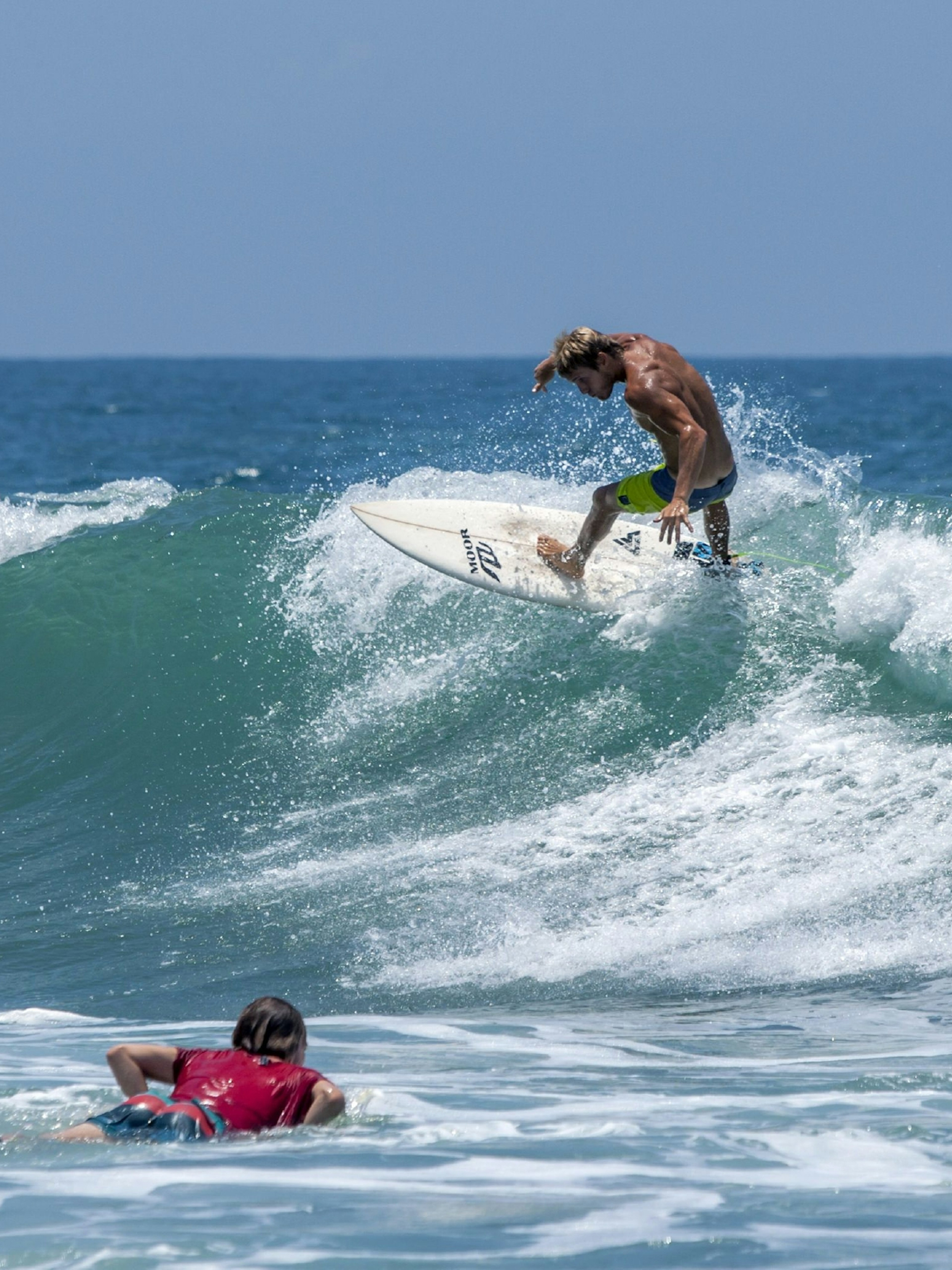 A surfer rides a wave at Arugam Bay's point break © Thomas Wyness / Shutterstock