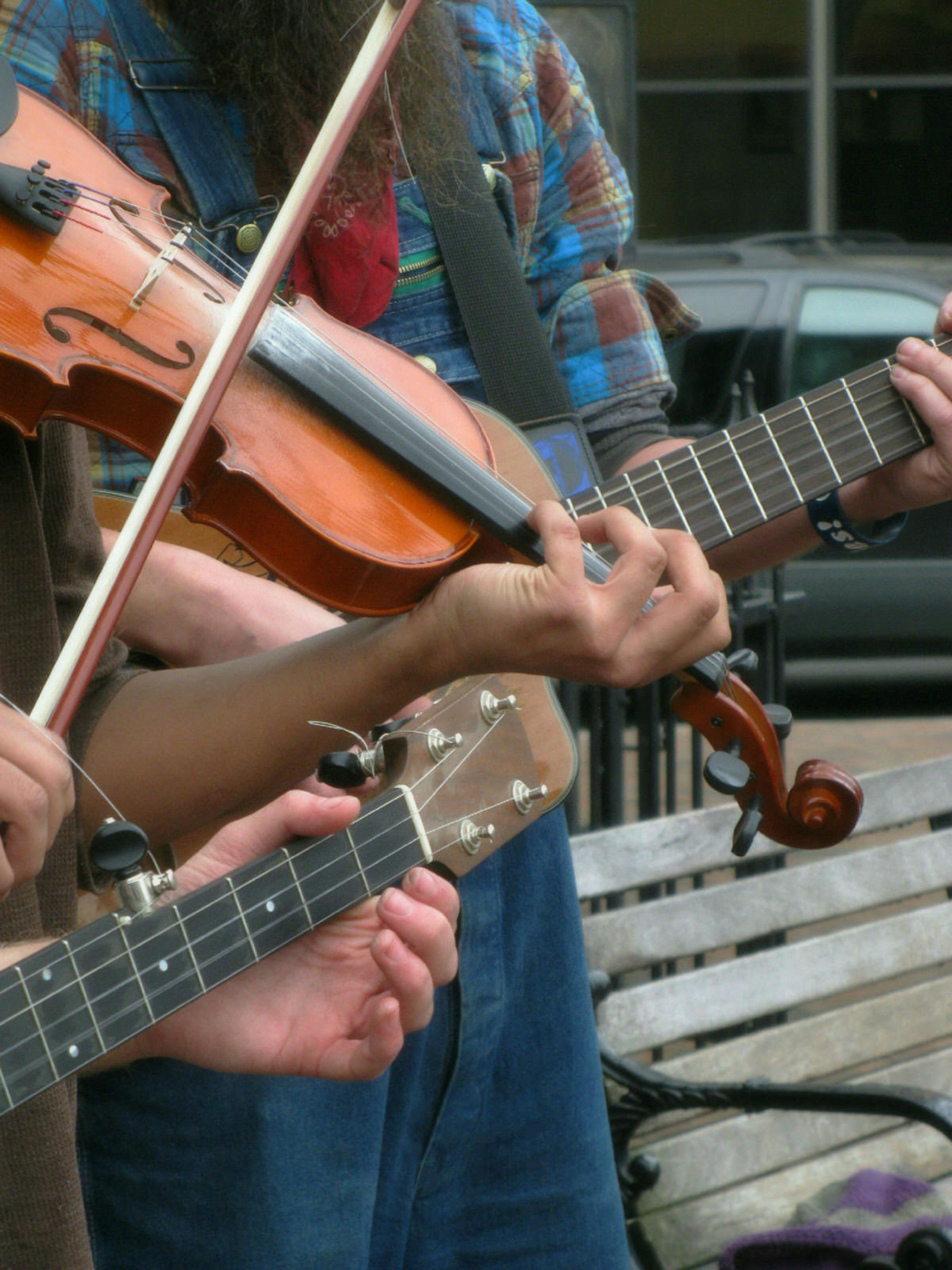 Musicians busking on the streets of Asheville, North Carolina, showcasing the city's musical vibrancy.