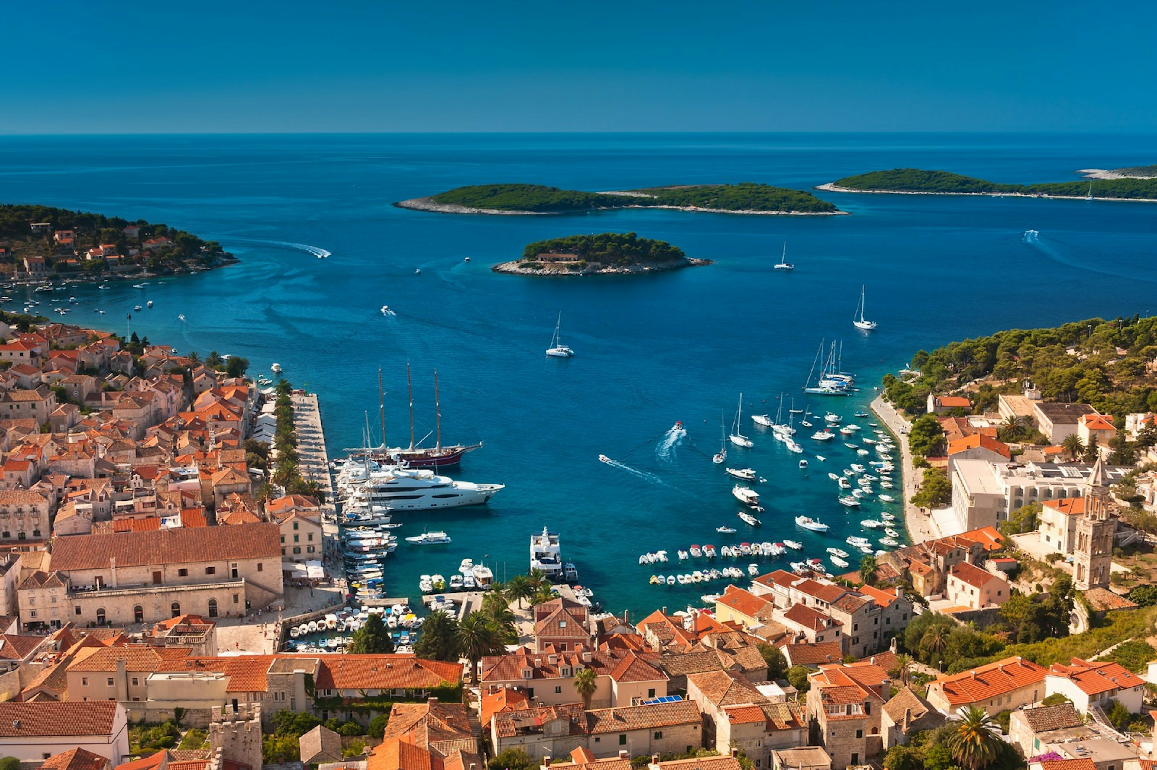 A view from above of Hvar Town's square harbour, with the Pakleni Islands in the distance © Evgeniya Moroz / Shutterstock