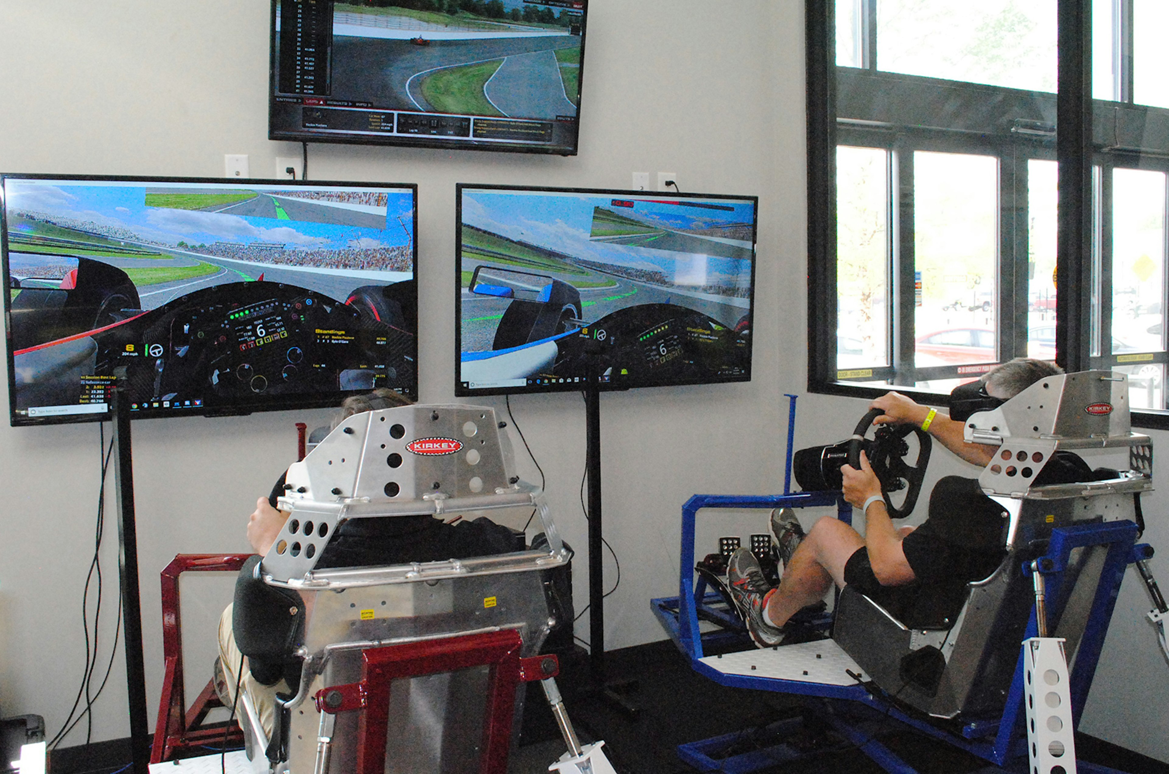 two men play IndyCar simulators at SIK in Indianapolis © SIK