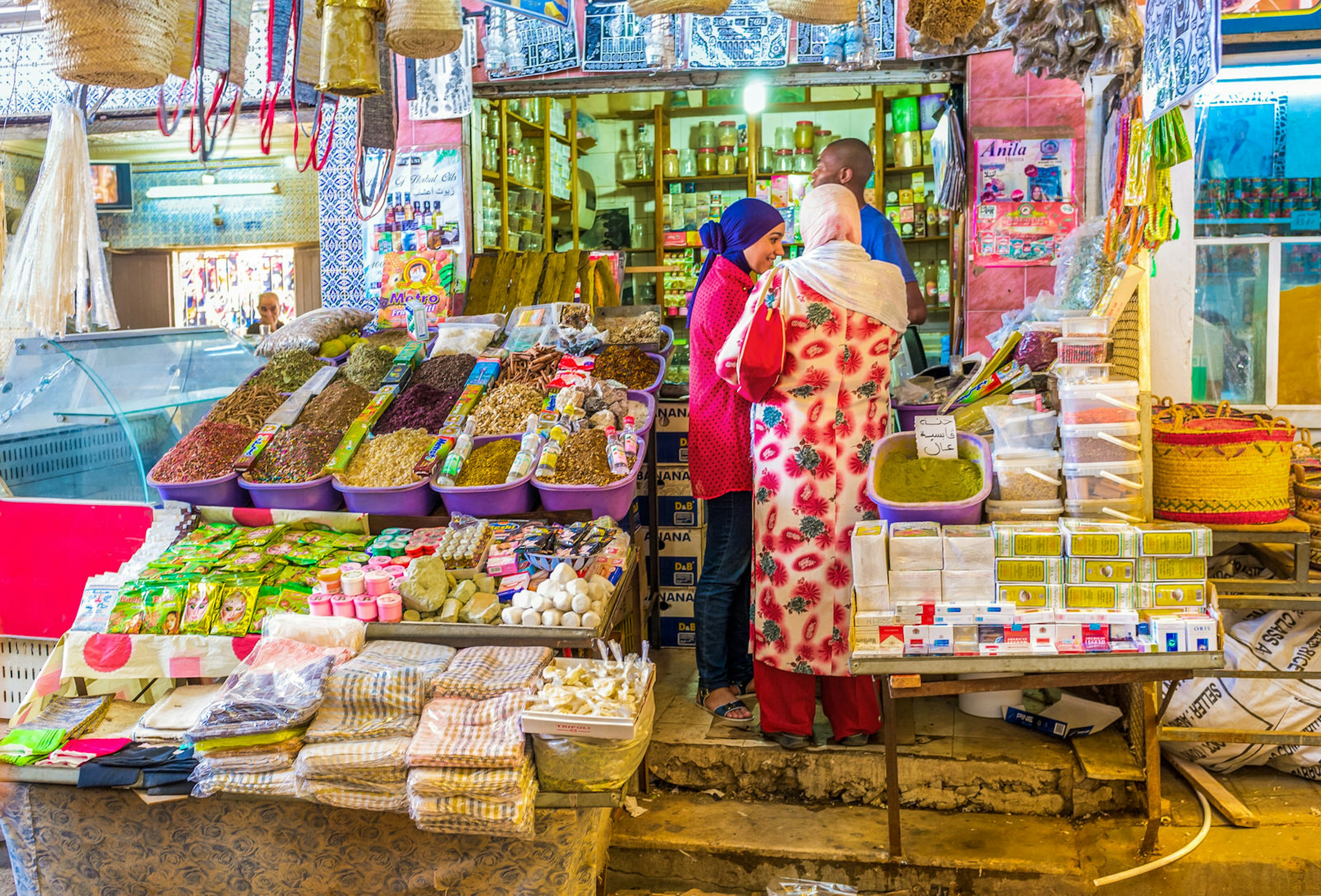 Locals in a market stall the souq in Sfax, Tunisia, that offers spices and traditional cosmetics