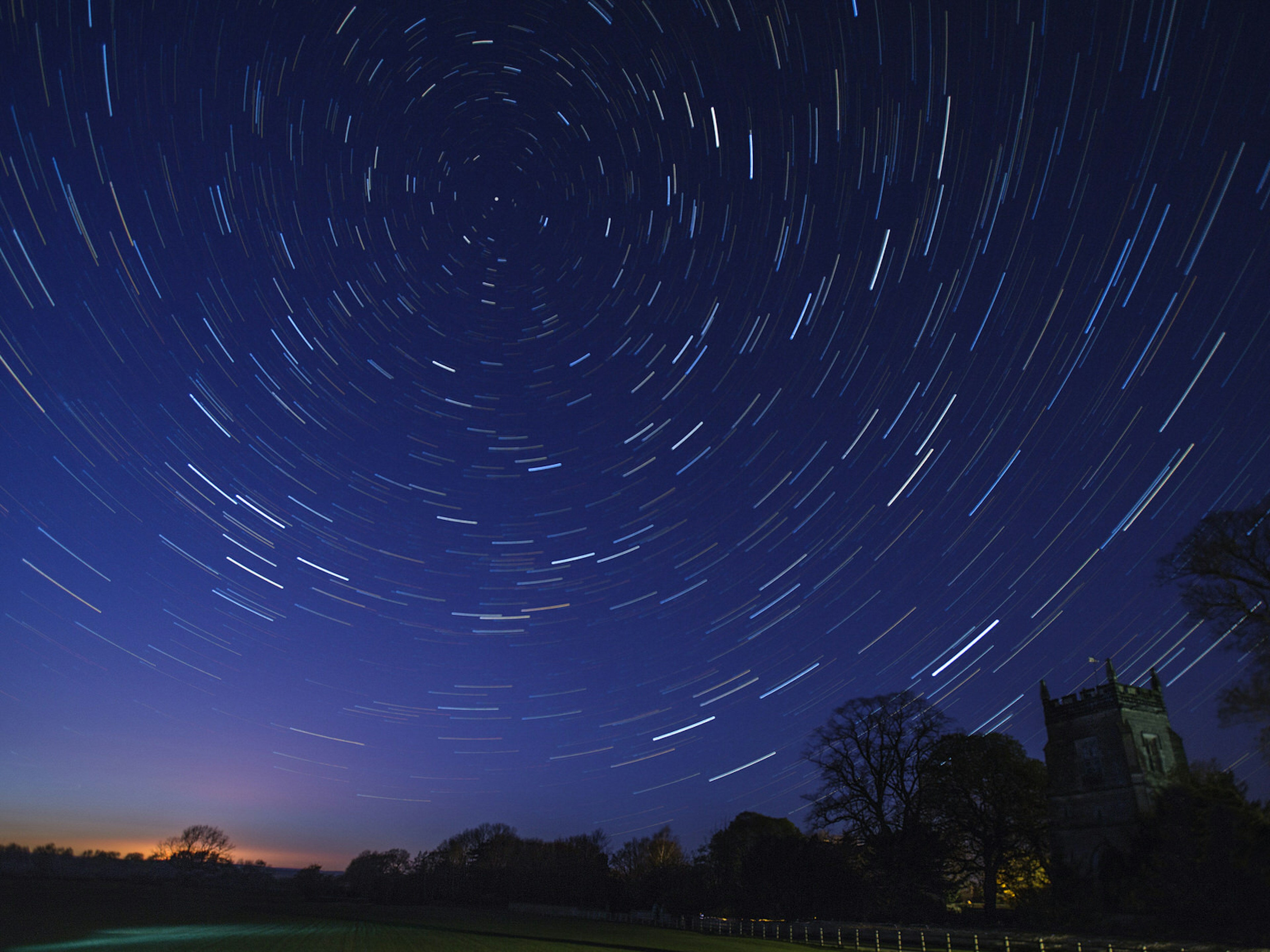 Star Trails in early spring above a small village church in north Yorkshire