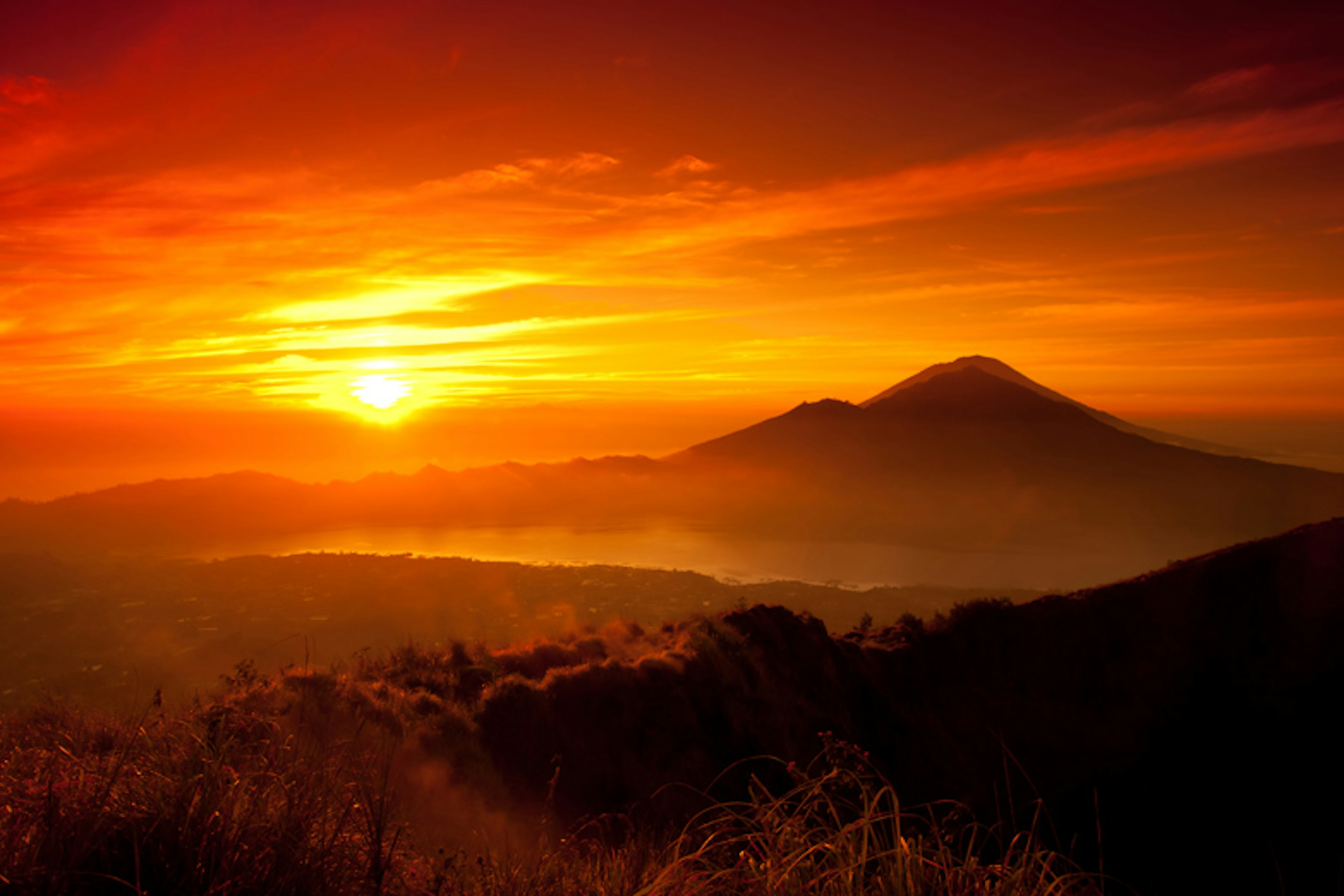 Sunrise over Mount Batur. Image by Dennis Stauffer / Flickr / Getty