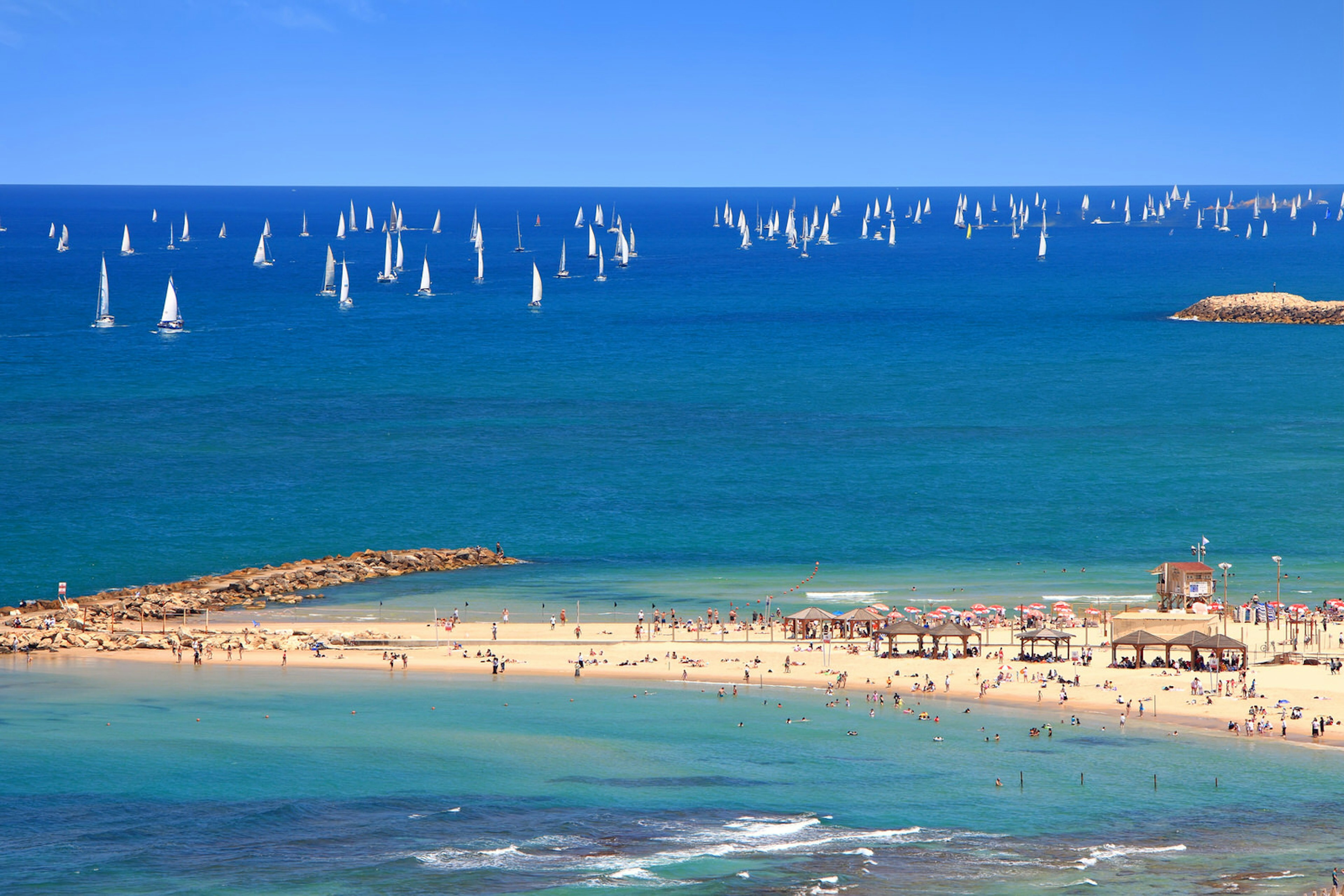 Panoramic top view of Tel Aviv beach and sailboats in the Mediterranean © Protasov AN / Shutterstock