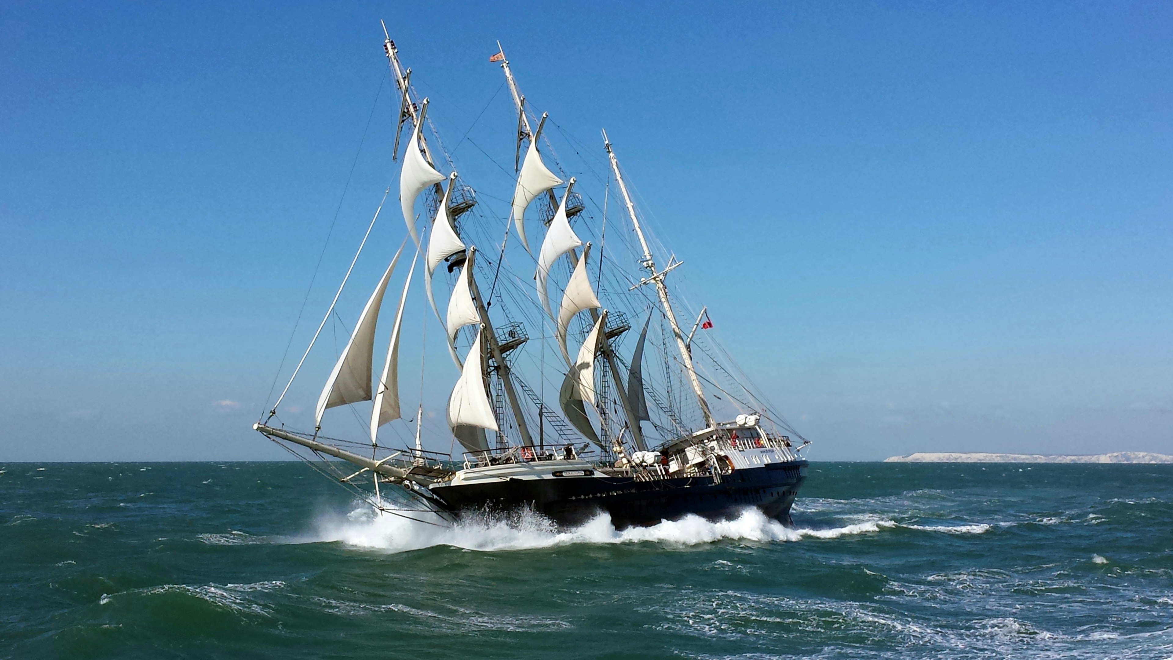 The SV Tenacious at sail on open sea