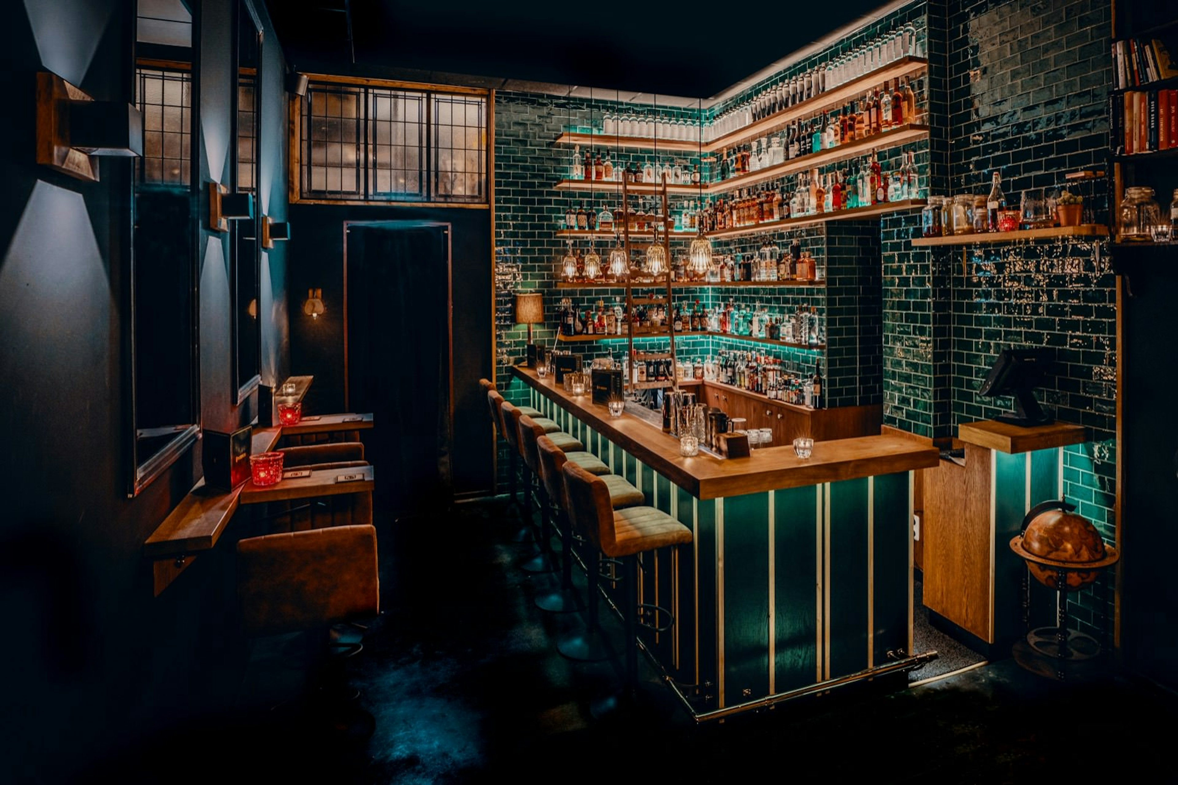 Groningen nightlife has been boosted by its first speakeasy - The Stockroom! The bar is dimly lit, with jade green tiled walls and a copper roof surrounding a fully-stocked cocktail bar © The Stockroom