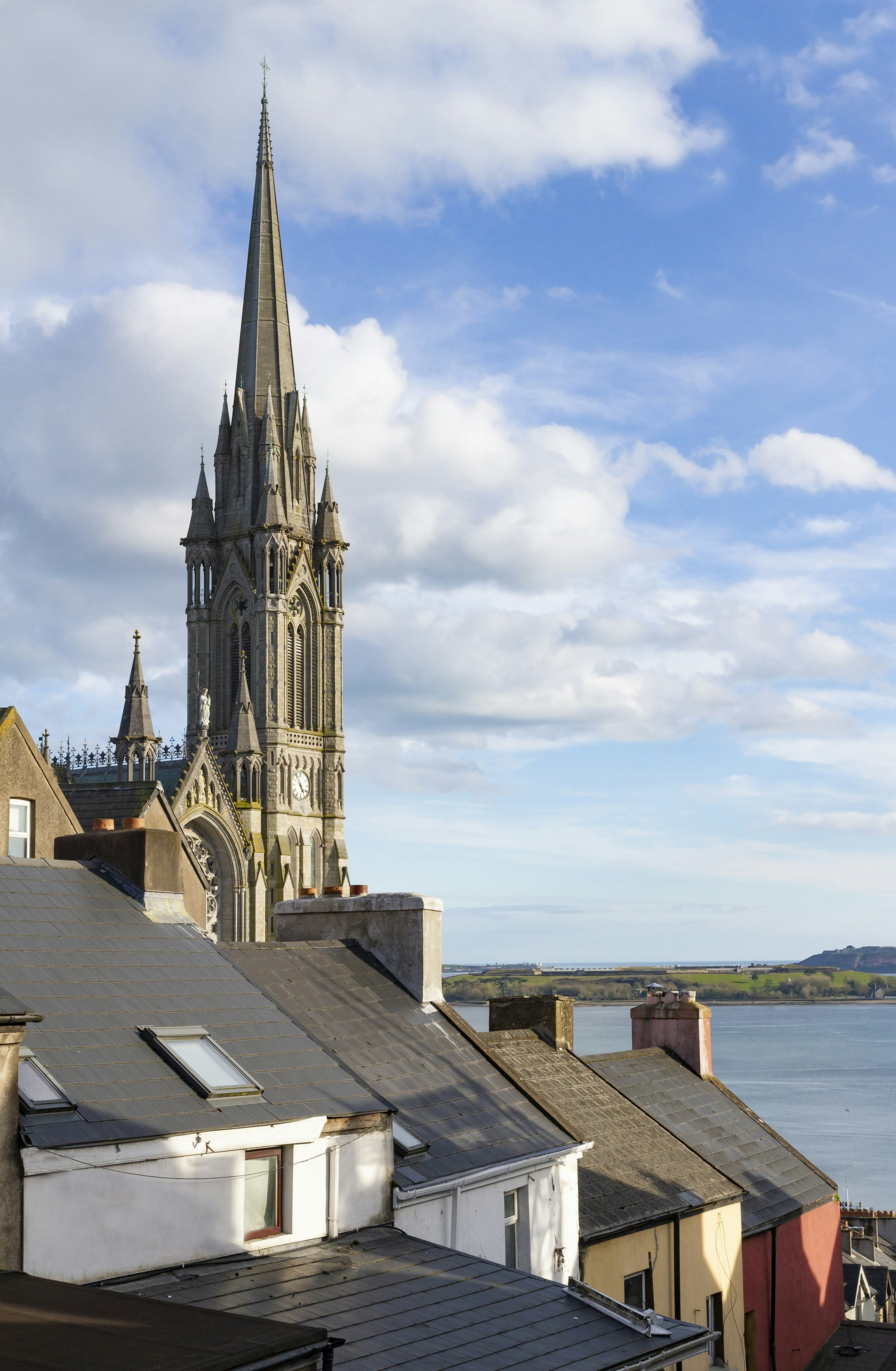 953971184
southern ireland, cathedral exterior, historic building, port, religious architecture, roman catholic church, sightseeing
Cobh's roads and houses sit steeply on the side of its hill. St Colman's Church dominates the skyline.