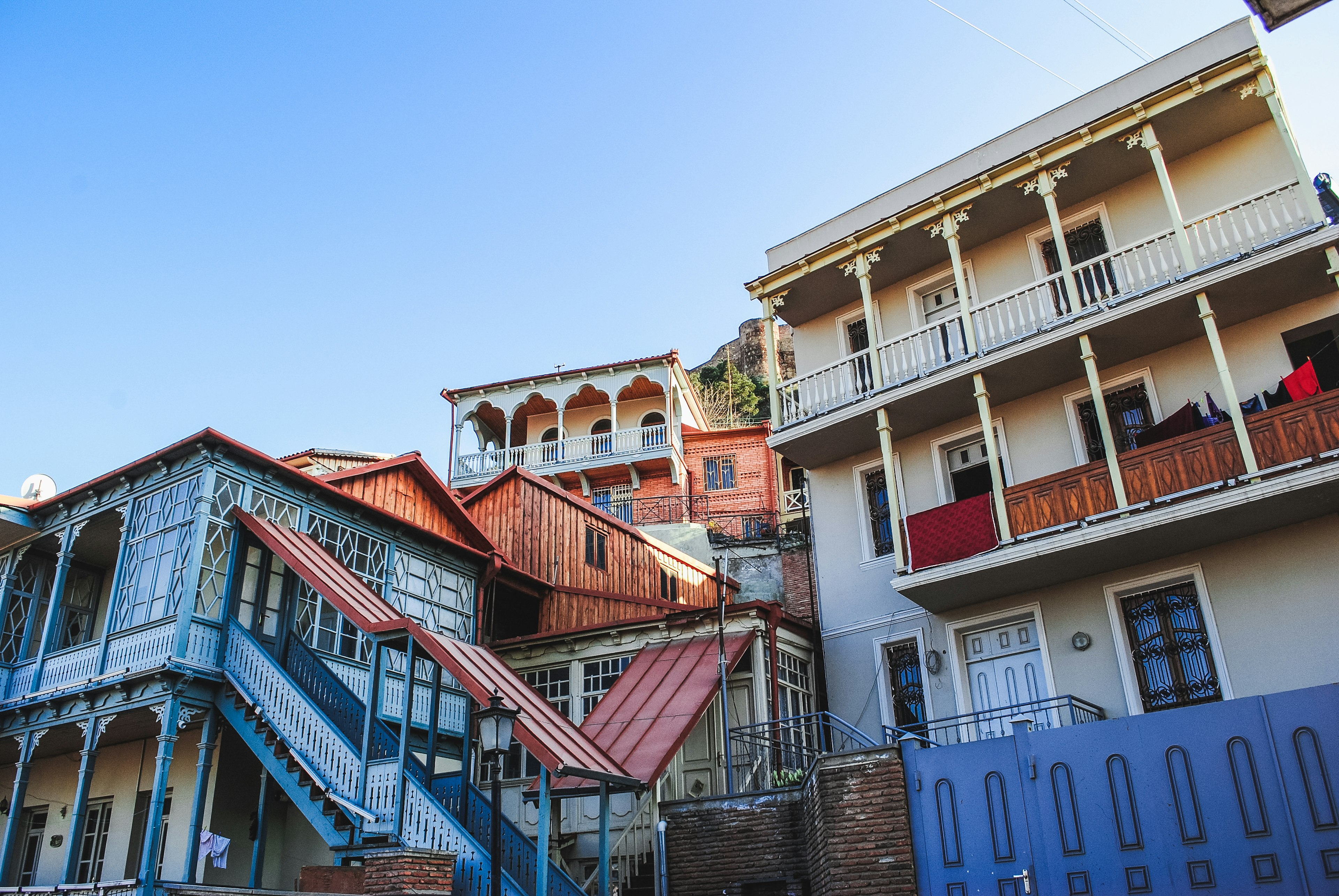 Densely packed, colourful houses in Tbilisi's hillside Old Town; the photo shows the carved wooden balconies that are typical of these old Georgian houses.