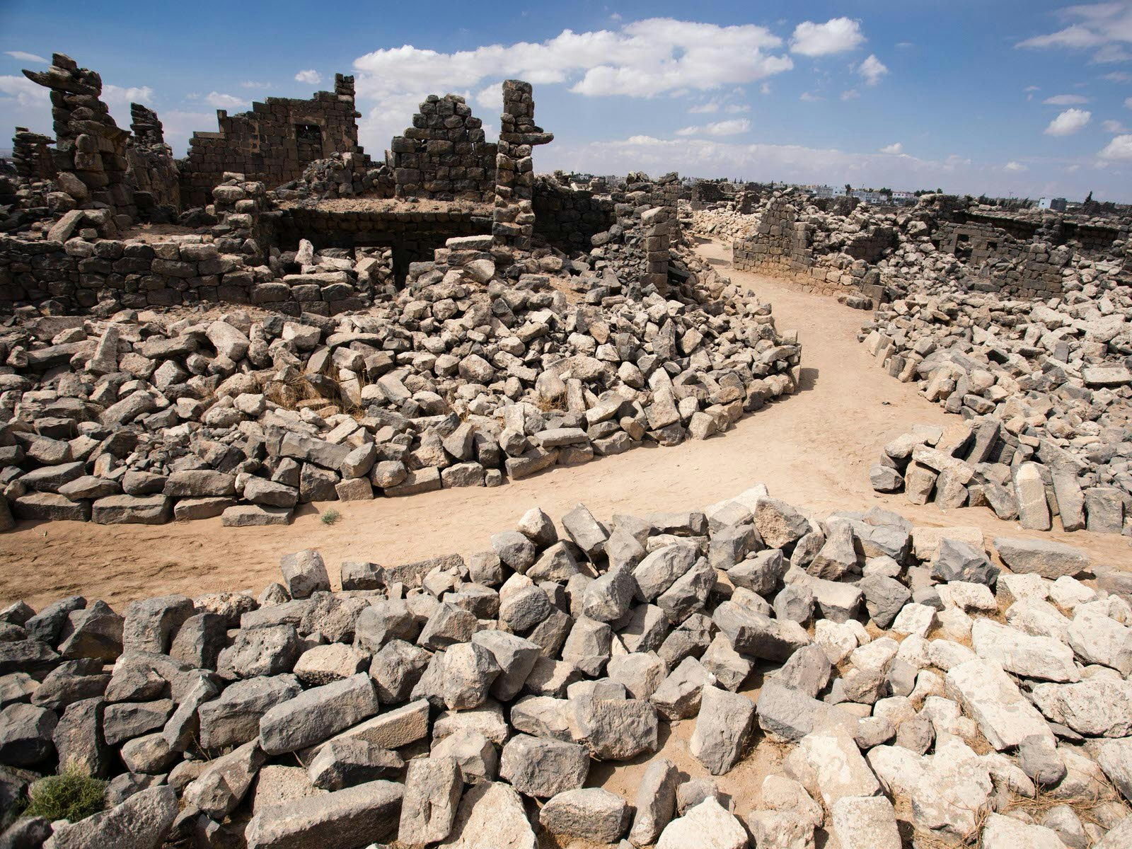 The rubble stone streets of Umm Al Jimal, Jordan © Stephen Lioy / Lonely Planet