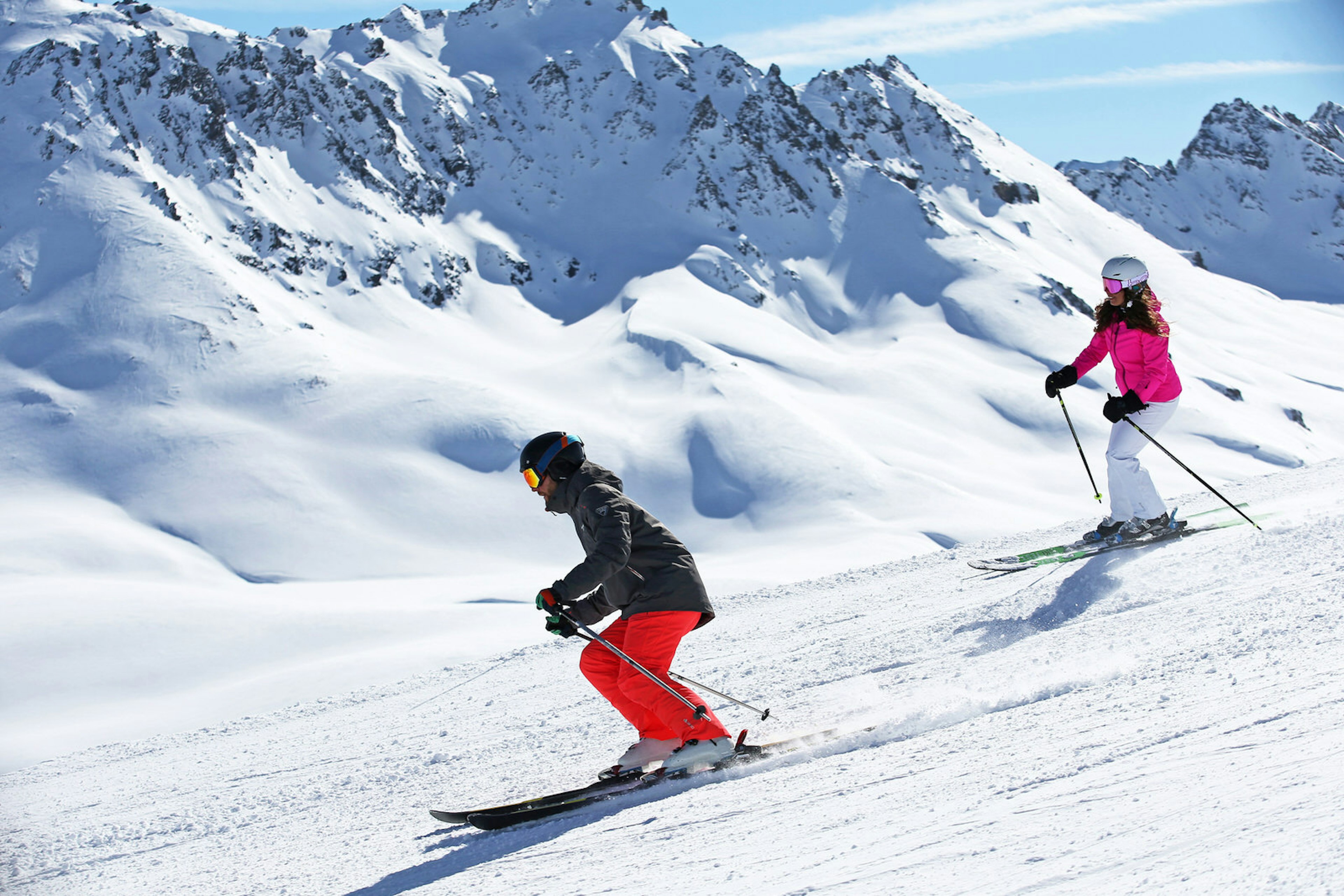 Two skiers heading downhill on a slope at Val d'Isère, France © Val d'Isère