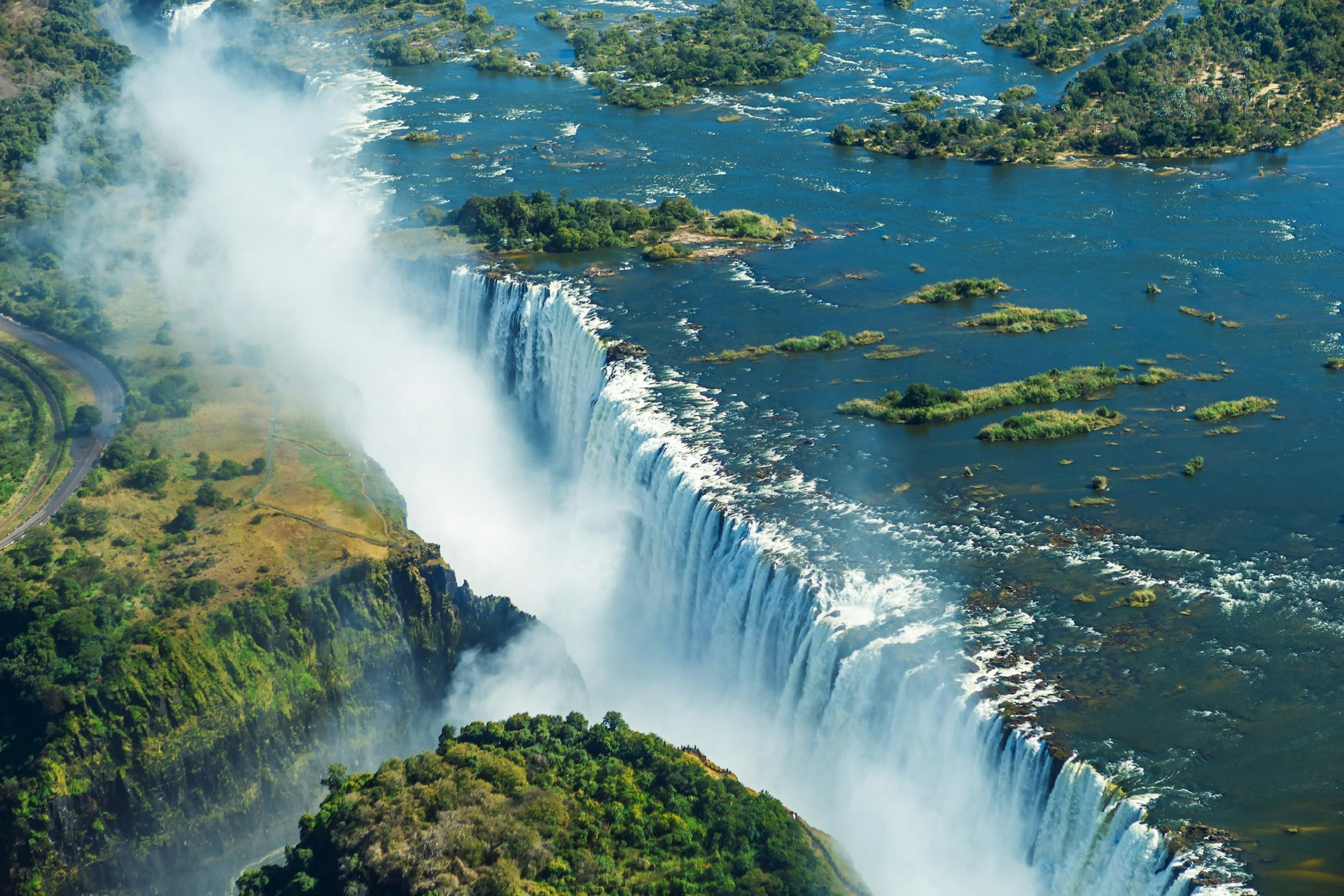 A curtain of water plunges over the mile-wide precipice that is Victoria Falls