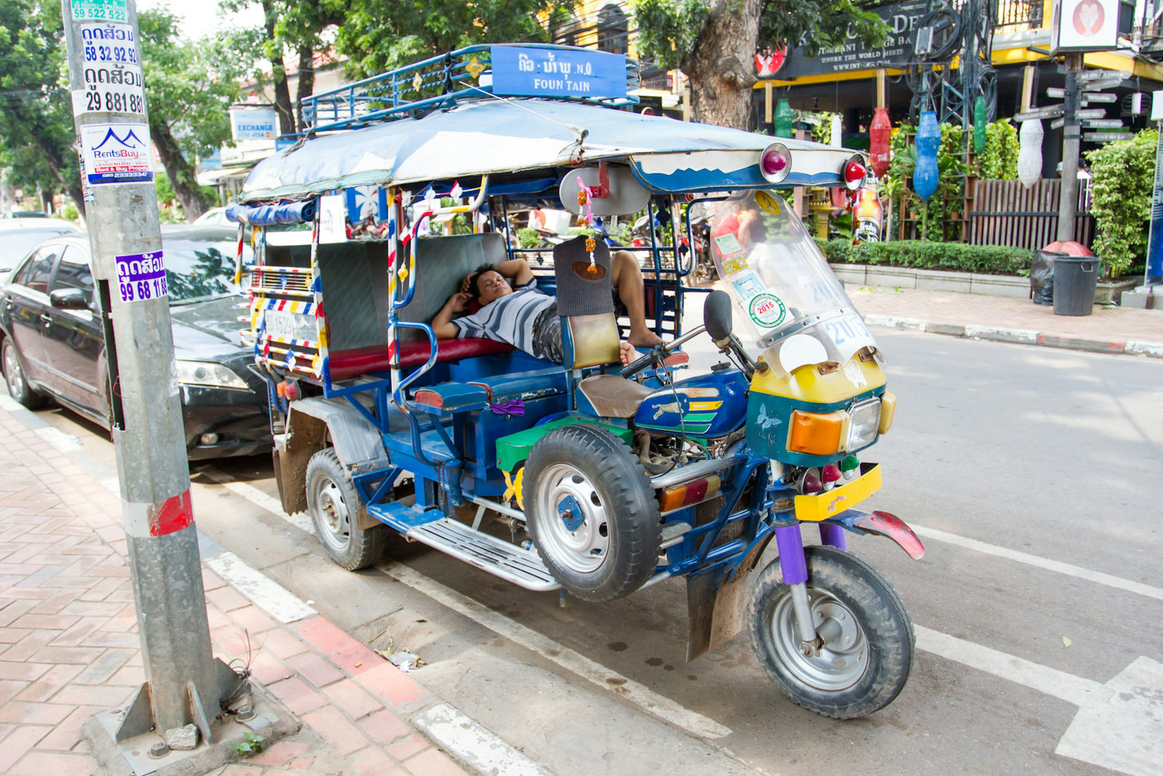 A tuk-tuk awaits its next passenger