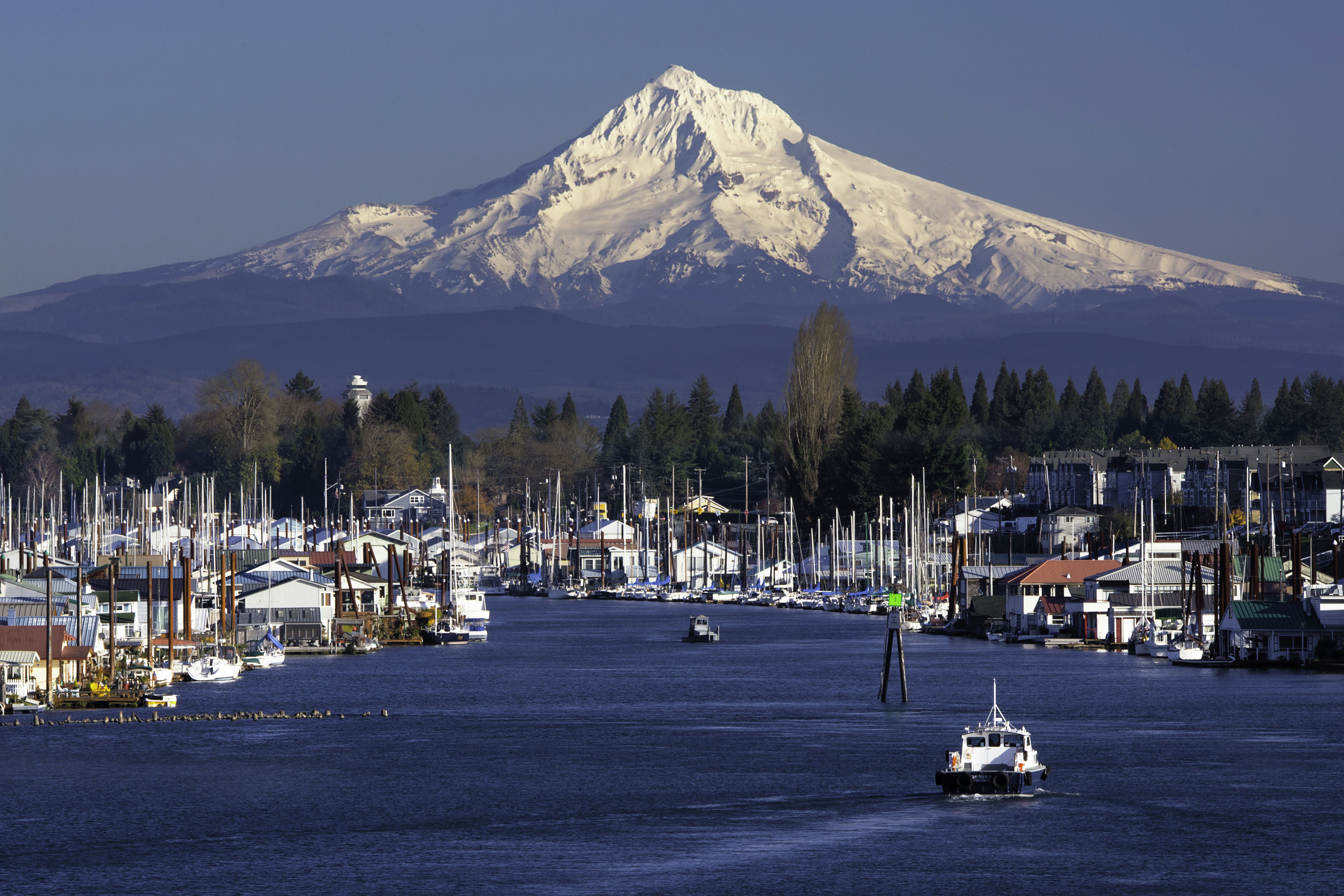 Mt Hood behind marina and houseboats on the Columbia River in Portland, Oregon.
