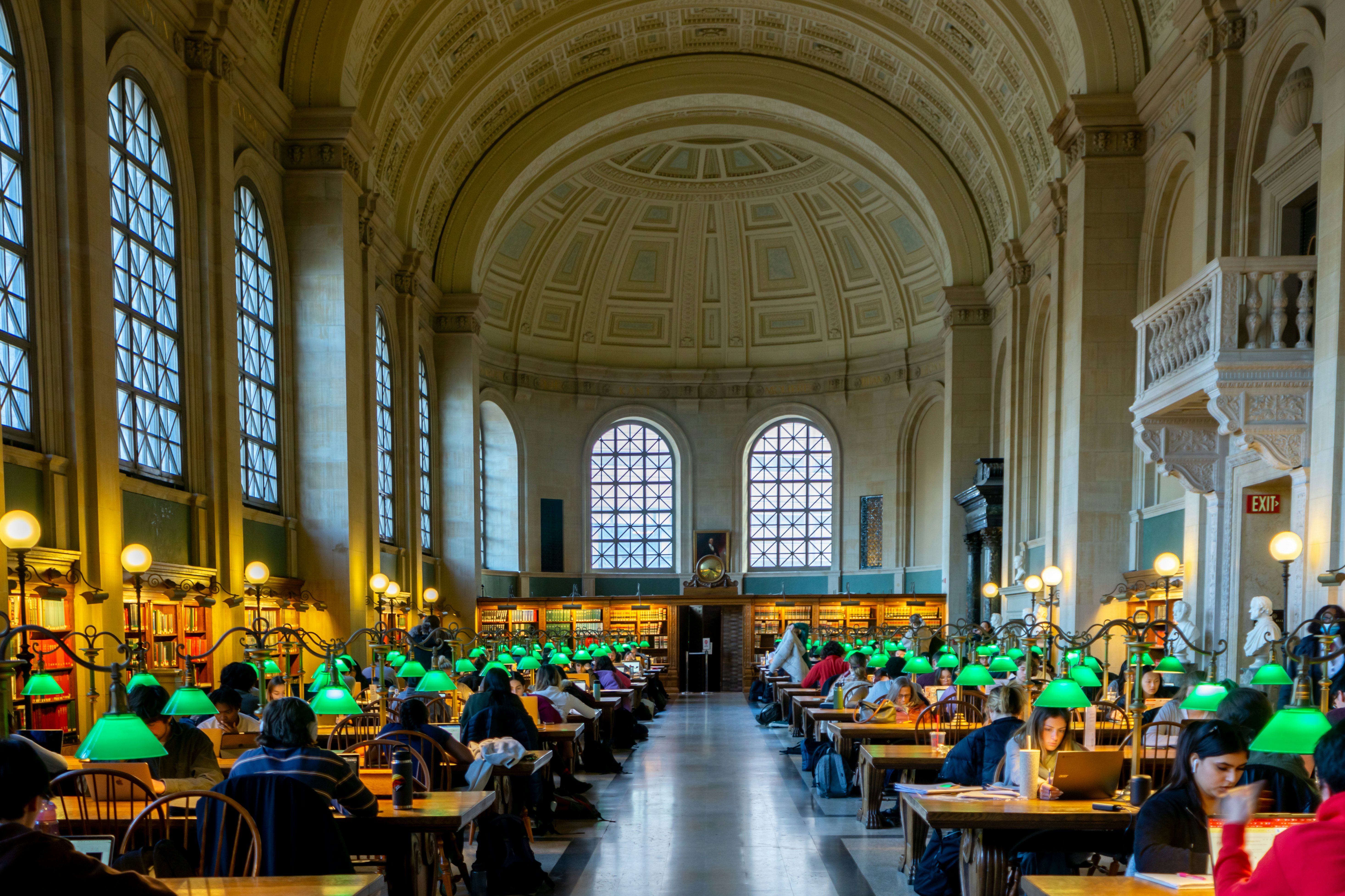 Wide angle image of a main room at the Boston public library.