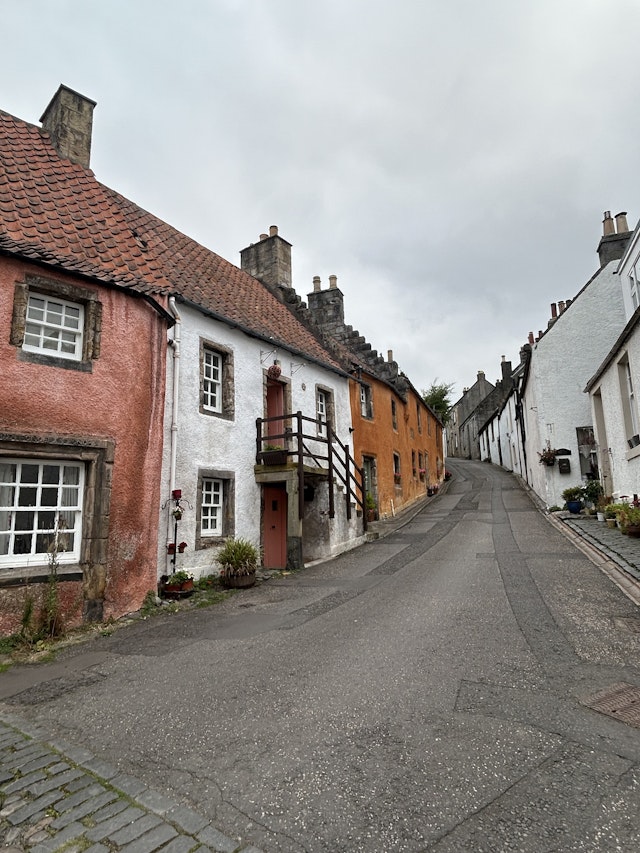 A side street with colorful houses in the village of Culross