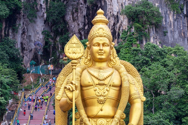 Combine Diwali in Kuala Lumpur with a trip to the Hindu shrines inside the Batu Caves. Pakin Songmor/Getty Images