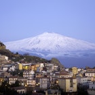 View of the village of San Teodoro and Etna volcano on background. Sicily, Italy.
141215014
Mediterranean Countries, Residential Building, Building Exterior, Twilight, Scenics, Idyllic, Blue, Italian Culture, Urban Scene, Panoramic, Sicily, Italy, Sunset, Mt Etna, Volcano, Mountain, Sky, Snow, House, Built Structure, Urban Skyline, Cityscape, Village, Town, Symbol
Etna Volcano - stock photo
View of the village of San Teodoro and Etna volcano on background. Sicily, Italy.