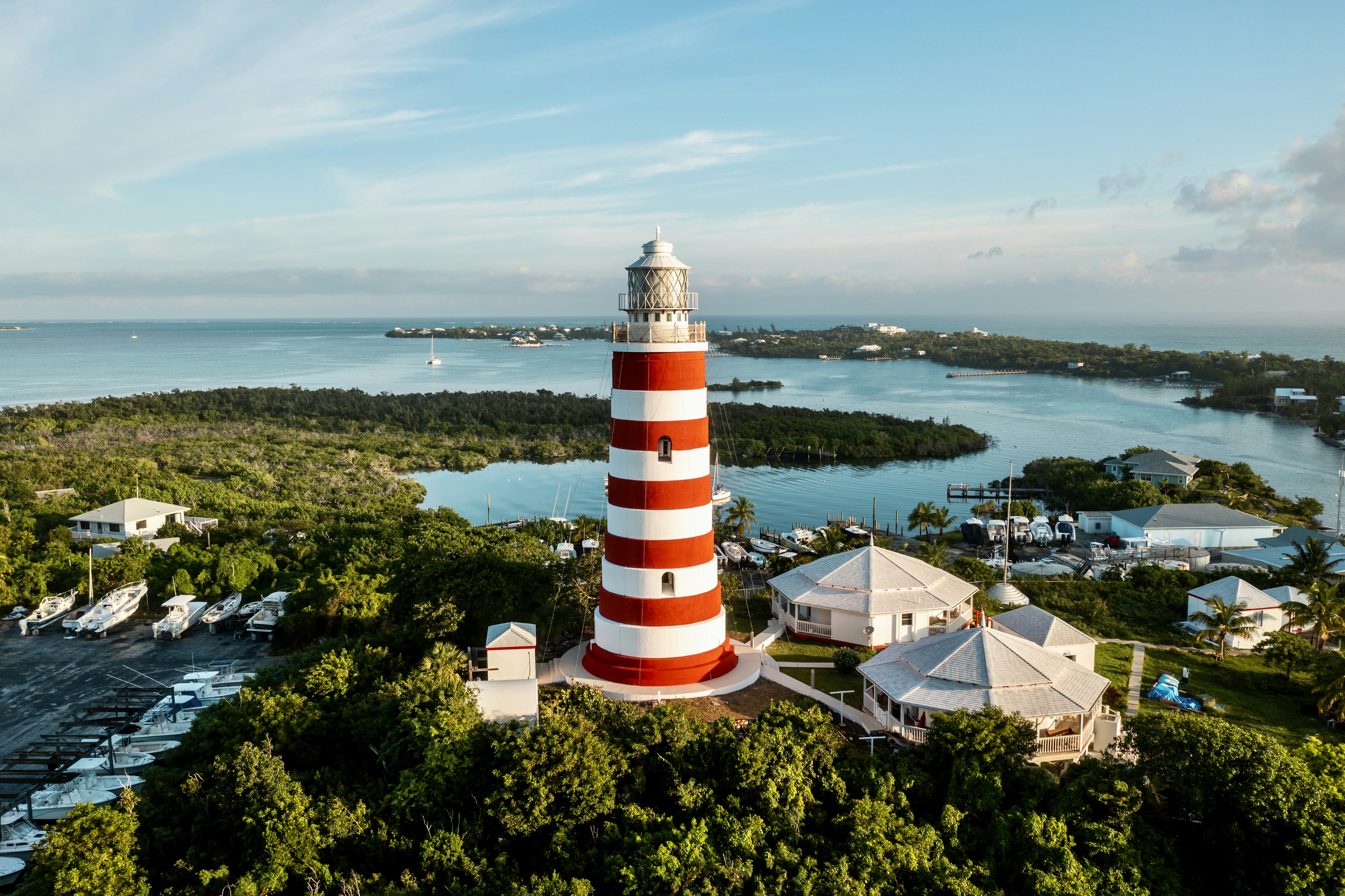 An aerial view of the red and white striped Lighthouse in Hope Town, Elbow Cay, the Bahamas