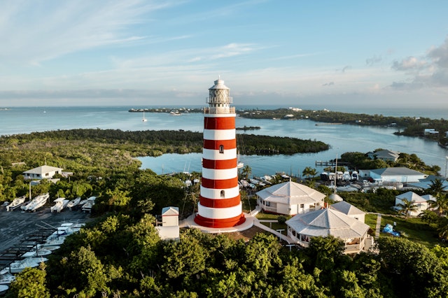 An aerial view of the red and white striped Lighthouse in Hope Town, Elbow Cay, the Bahamas