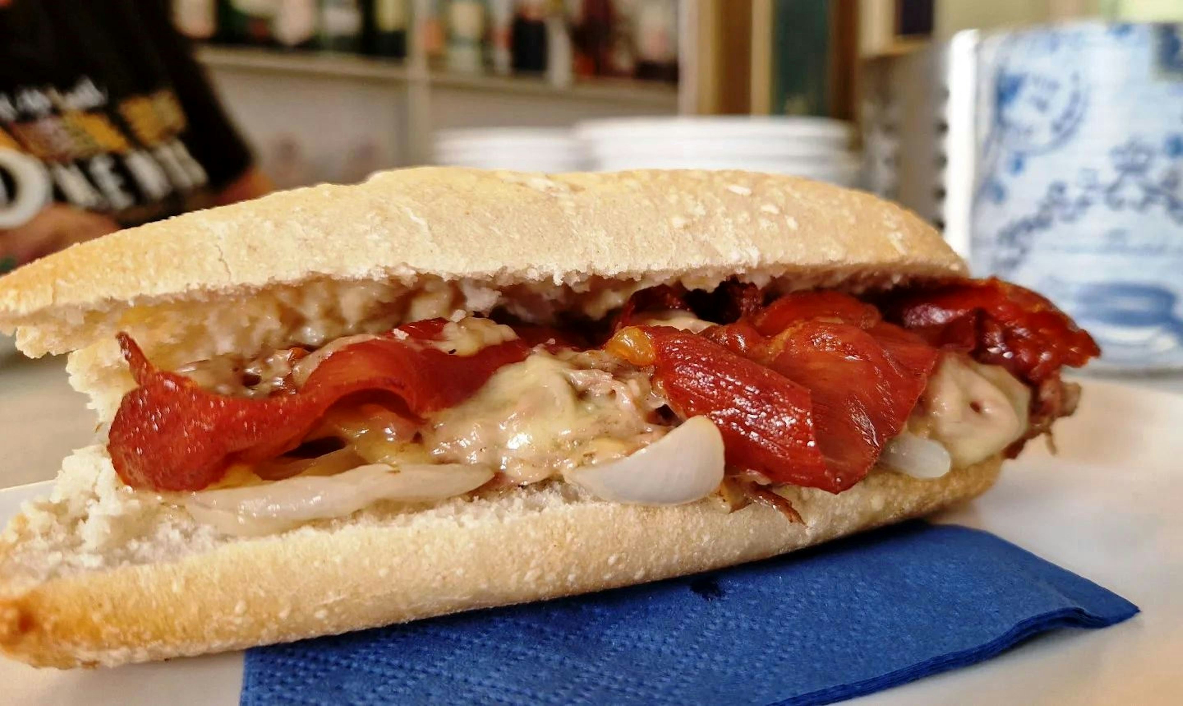 A Spanish bocadillo with meat, red pepper, fried onion and cheese, typical of the region of Valencia