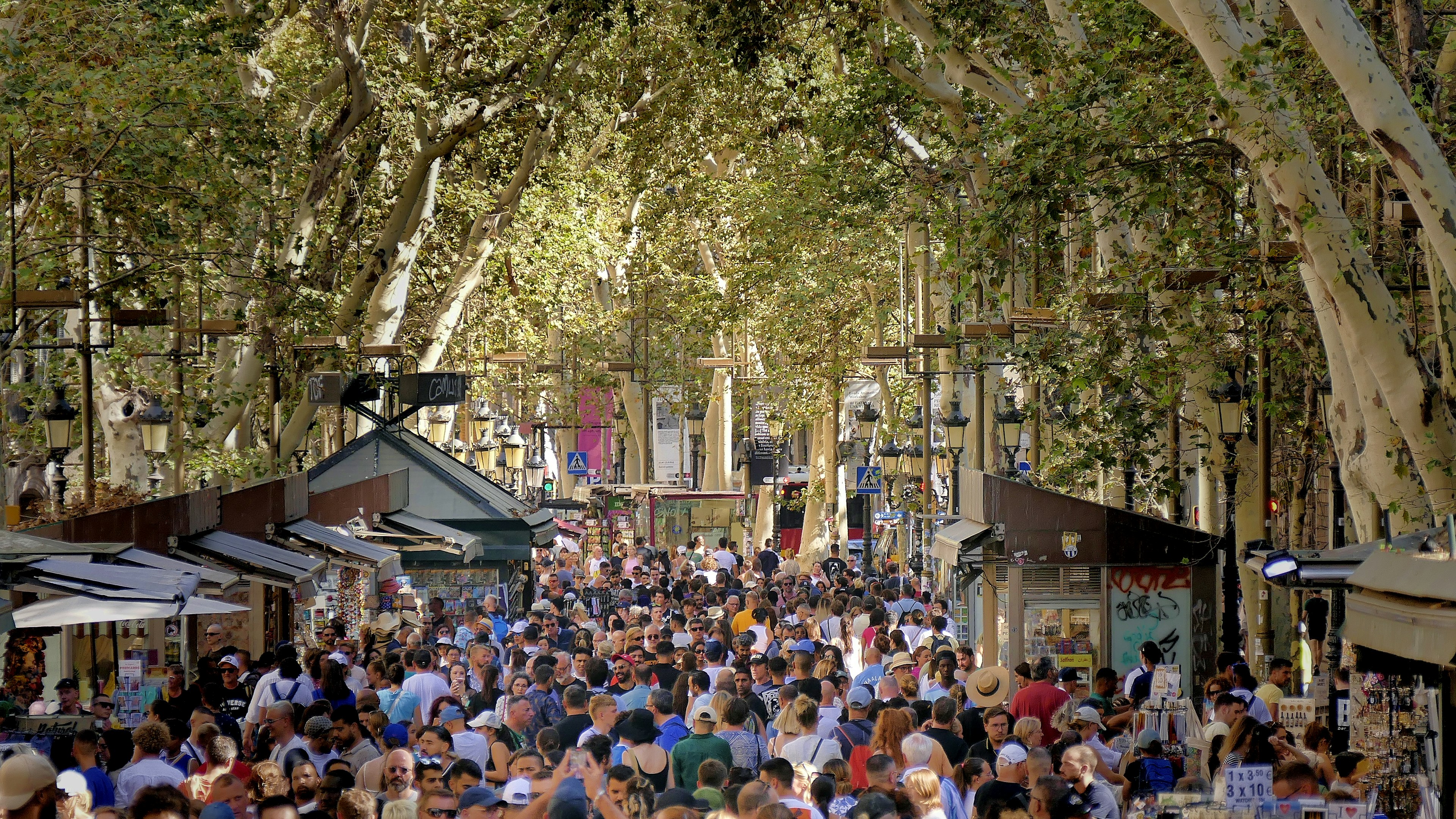 La Rambla crowded with people during the day in Barcelona, Spain