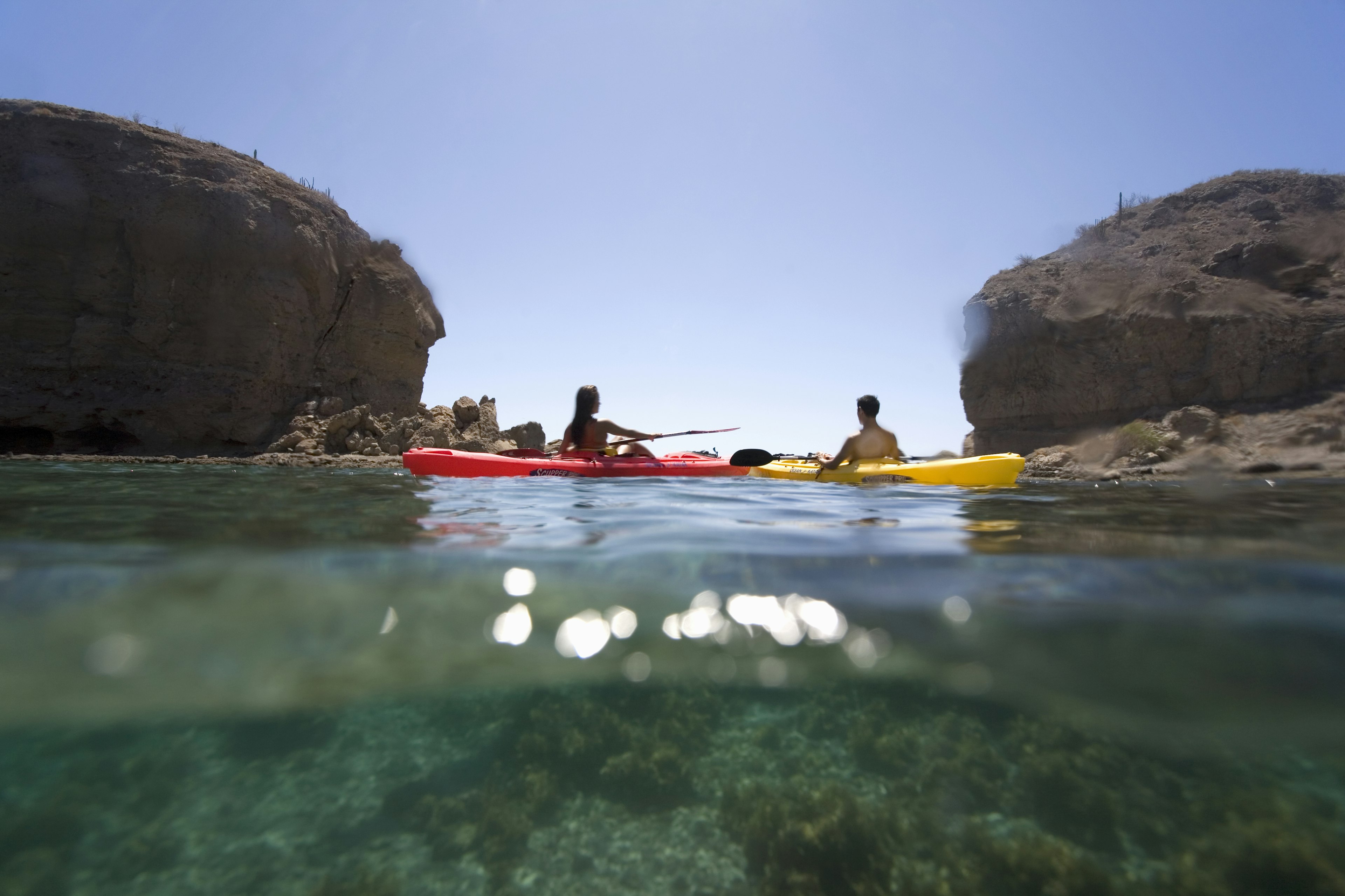 A woman and man kayaking in the Sea of Cortez, Loreto, Baja, Mexico.