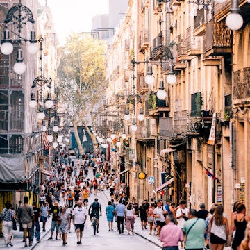 Crowded streets of Gothic Quarter on a sunny summer day, Barcelona, Spain