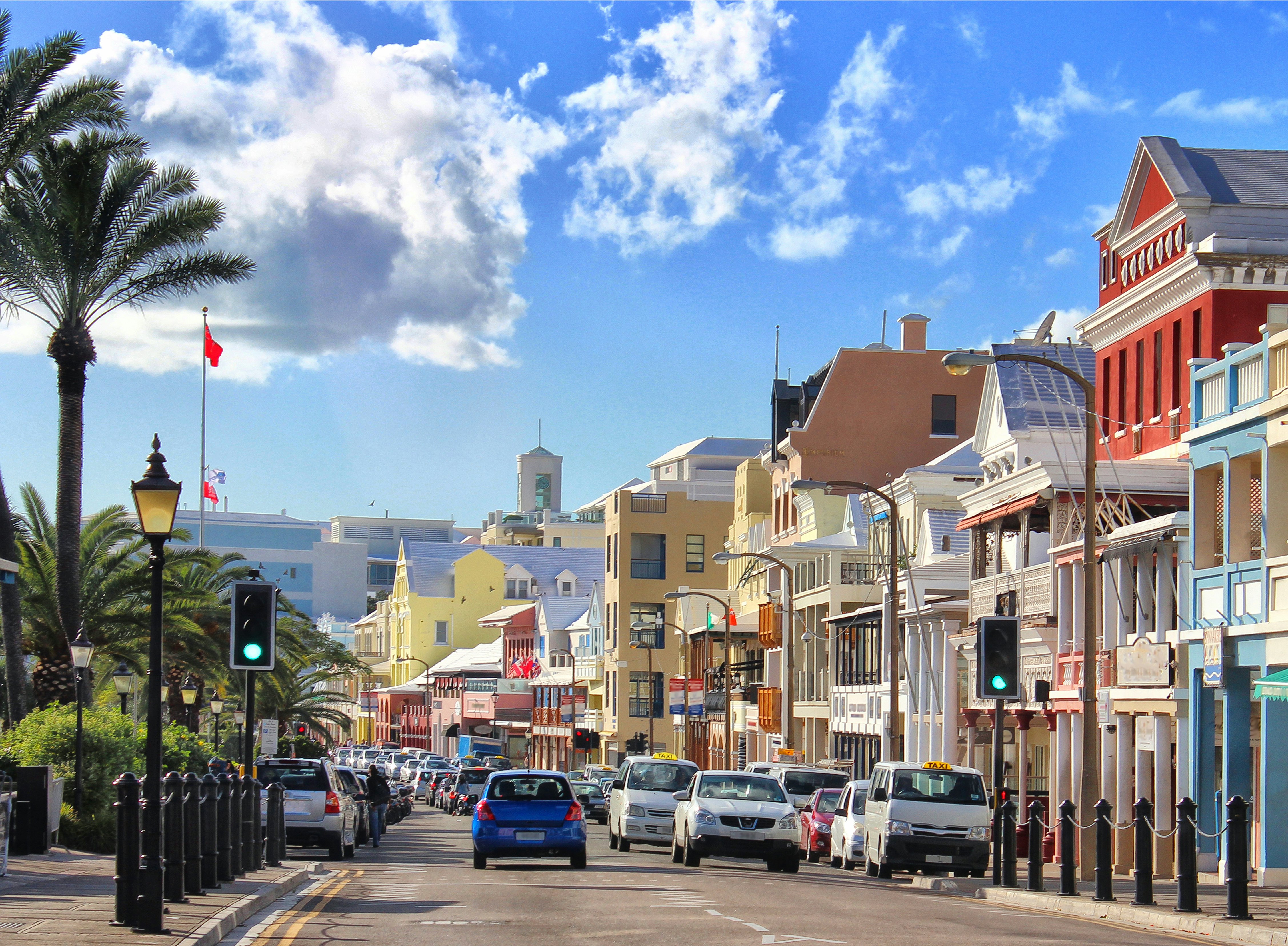 Front Street, Hamilton, Bermuda with cars on a sunny day