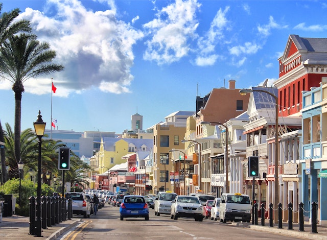 Front Street, Hamilton, Bermuda with cars on a sunny day