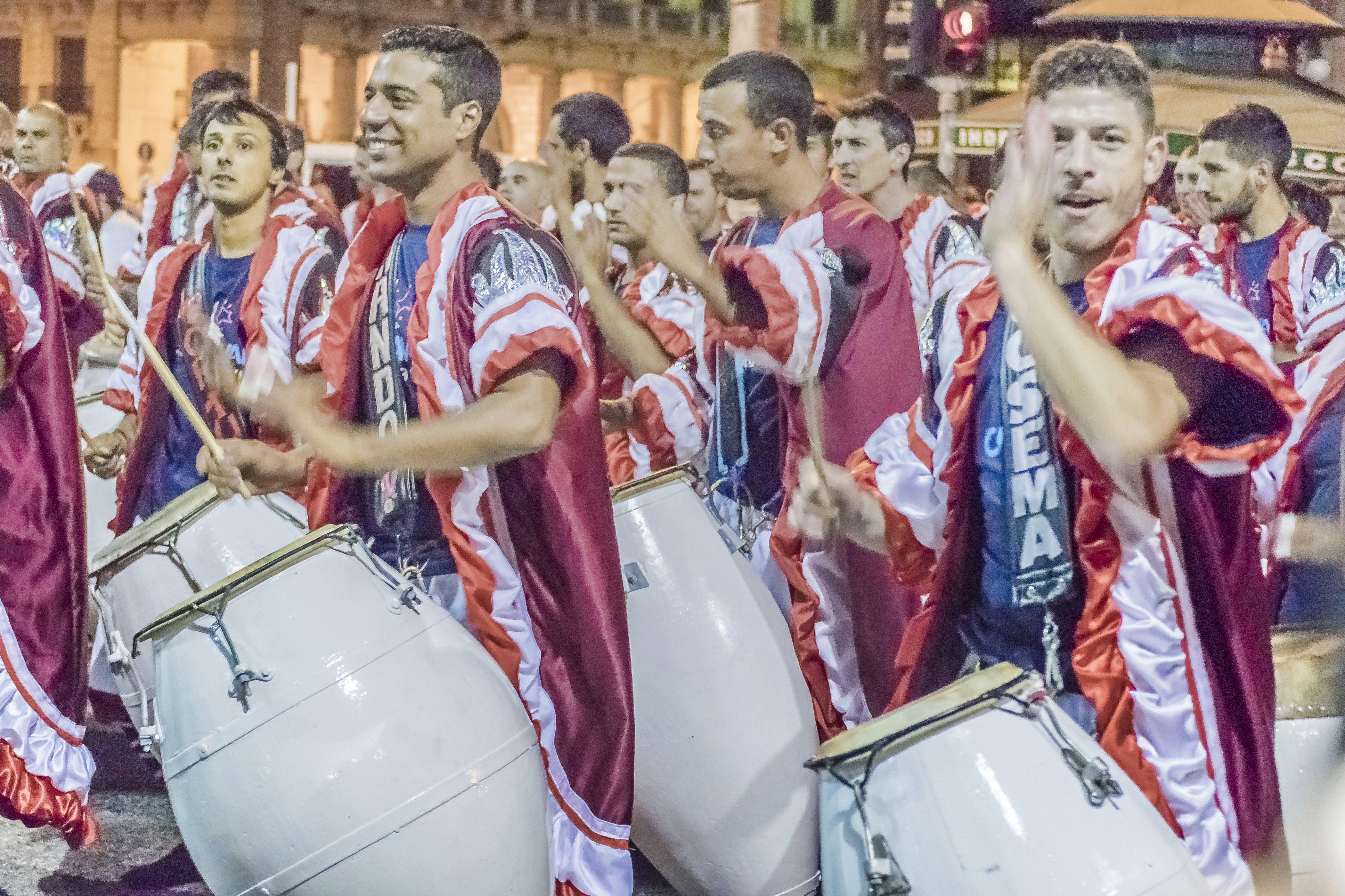 Costumed men drummers playing traditional music called candombe at the inaugural parade of carnival of Montevideo, Uruguay