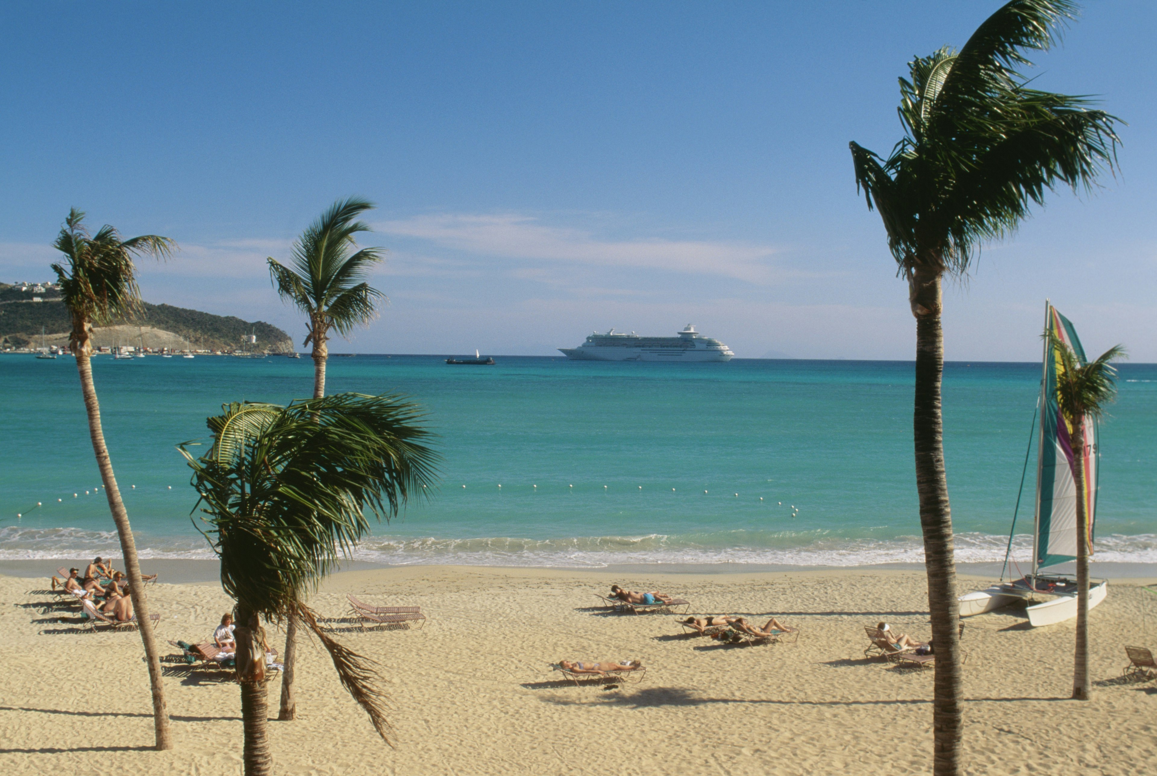 Large group of people are sunbathing on deck chairs, St. Martin, Leewards Islands, Caribbean