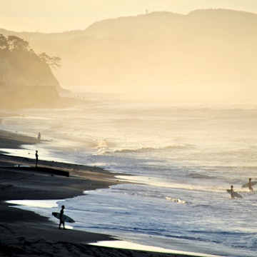 Surfers on the beach at Kamakura.