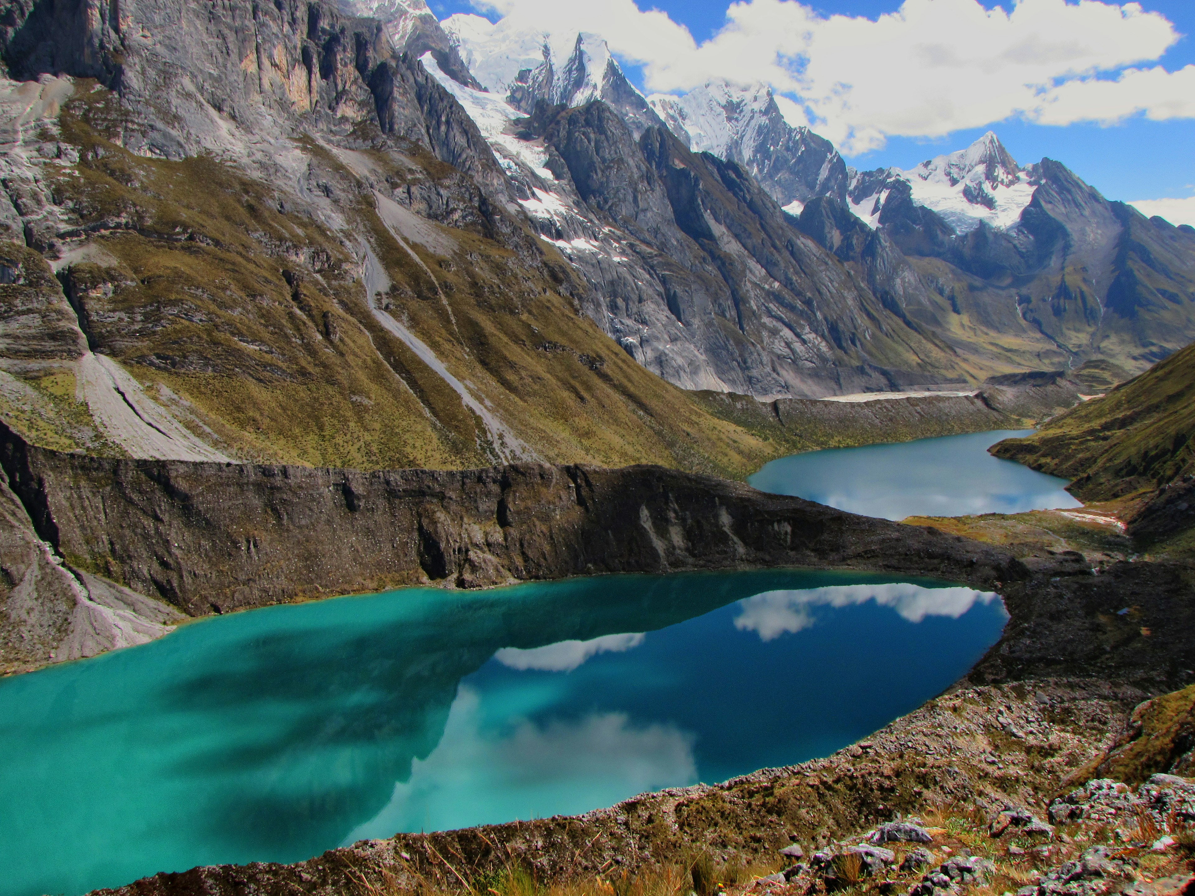 Image of a mountain range valley with two turquoise lakes.