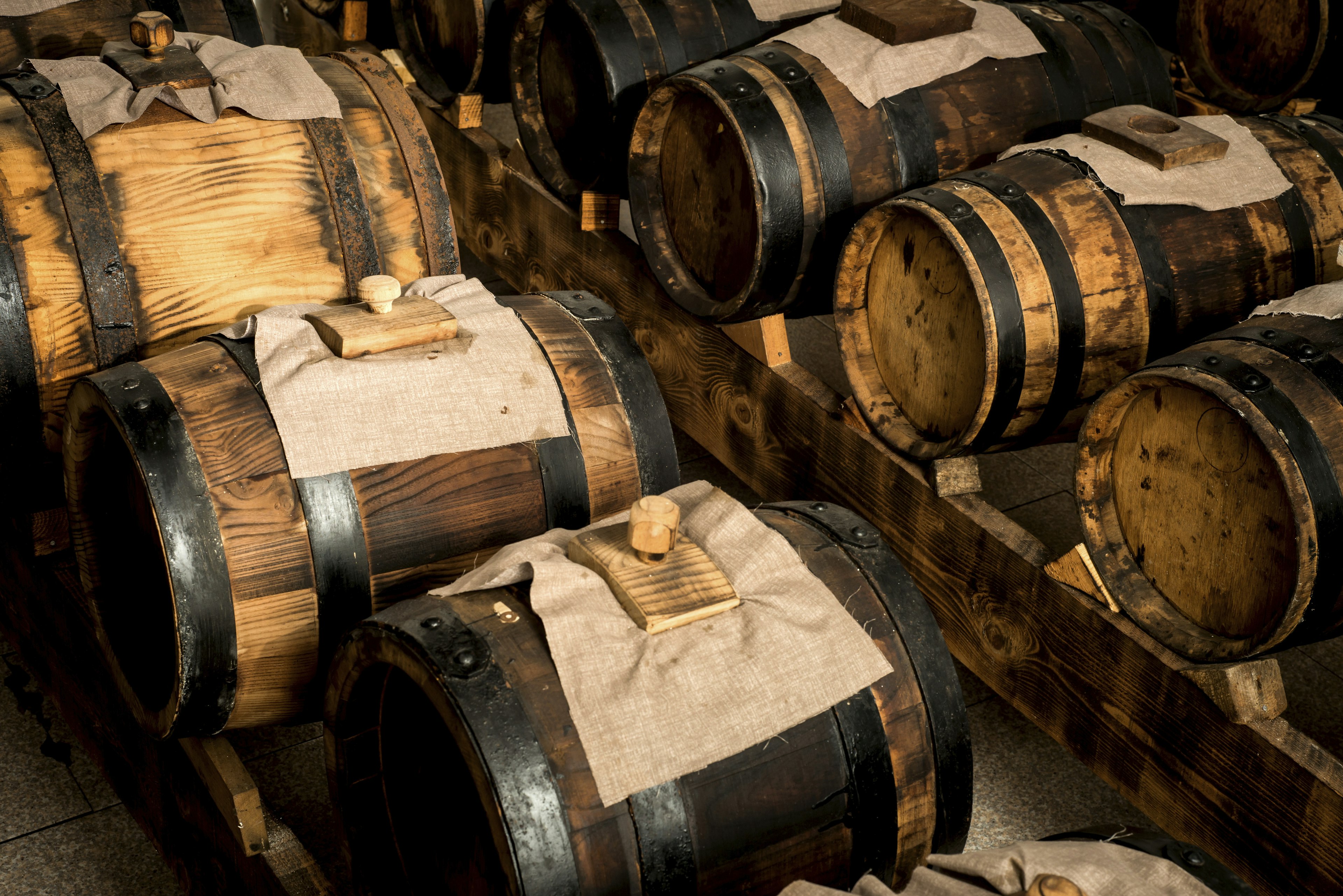 Modena balsamic vinegar stored in wooden barrrels.