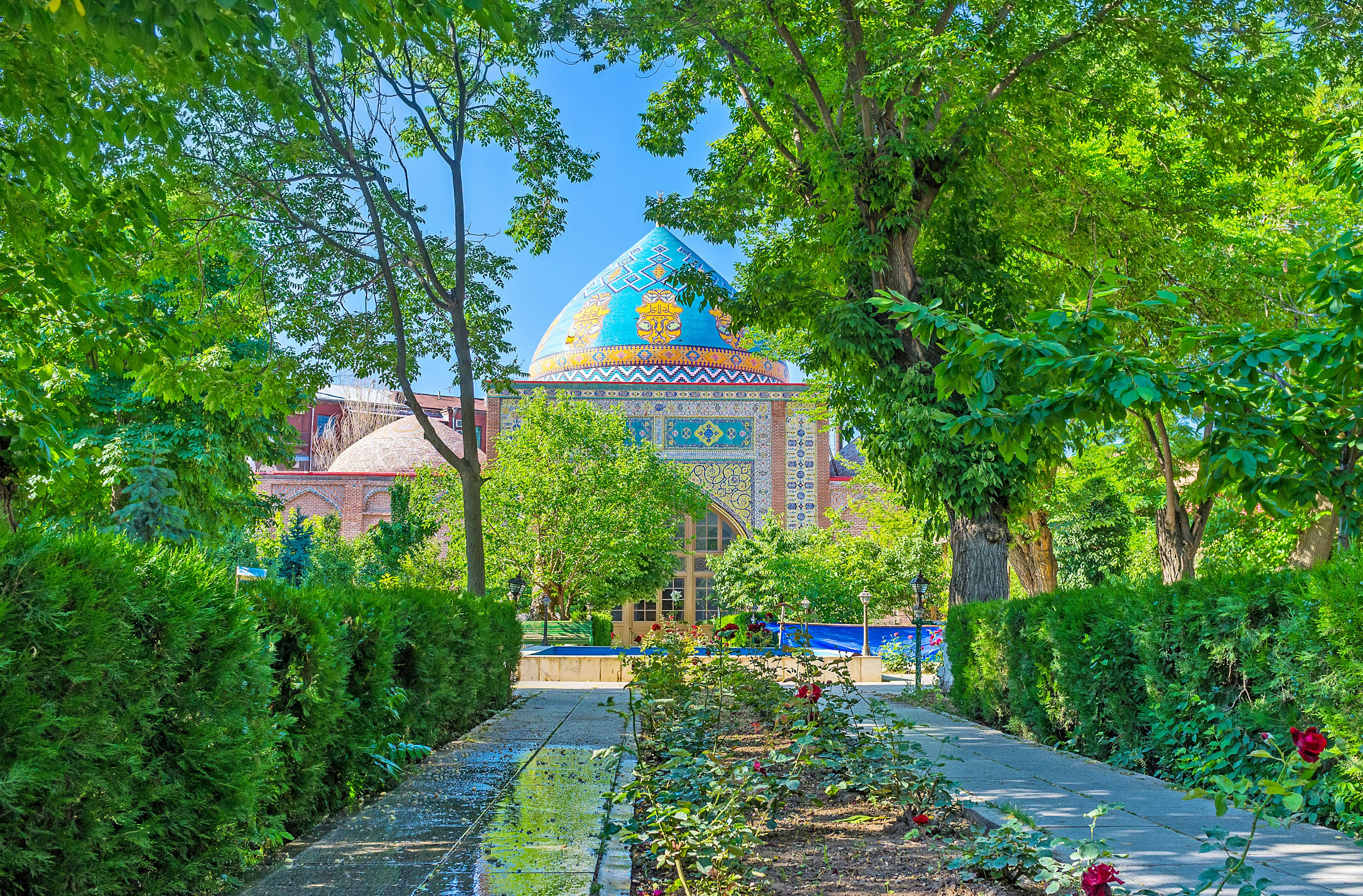 Yerevan's Blue Mosque, the only active mosque in Armenia, surrounded by trees and bushes.