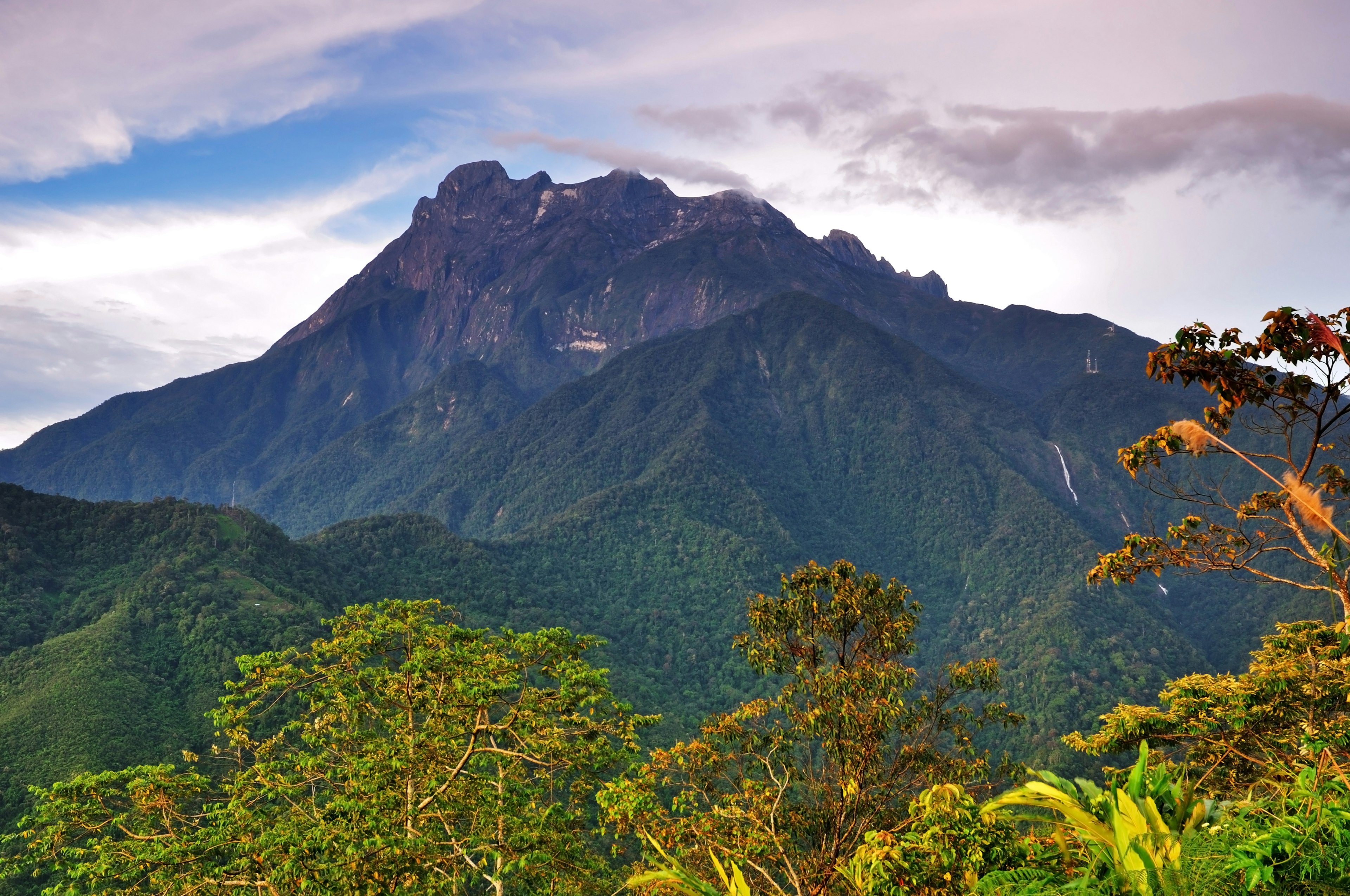 Borneo's Mount Kinabalu, a natural skyscraper with amazing biodiversity, soars into the sky.