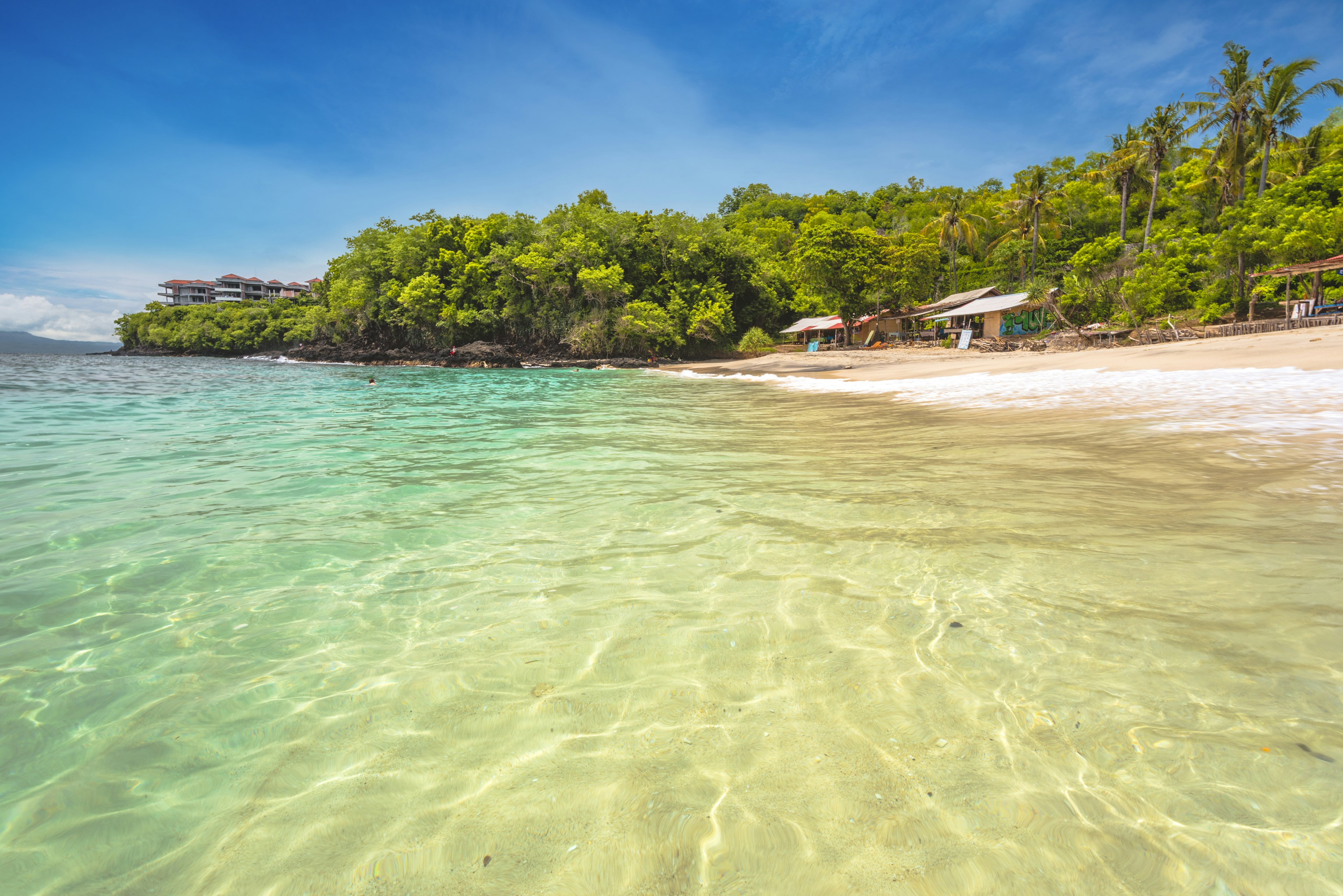 The White Sand Beach (Bias Tugel) is a popular local destination for its pristine turquoise waters. Padangbai, Karangasem, eastern Bali, Indonesia.