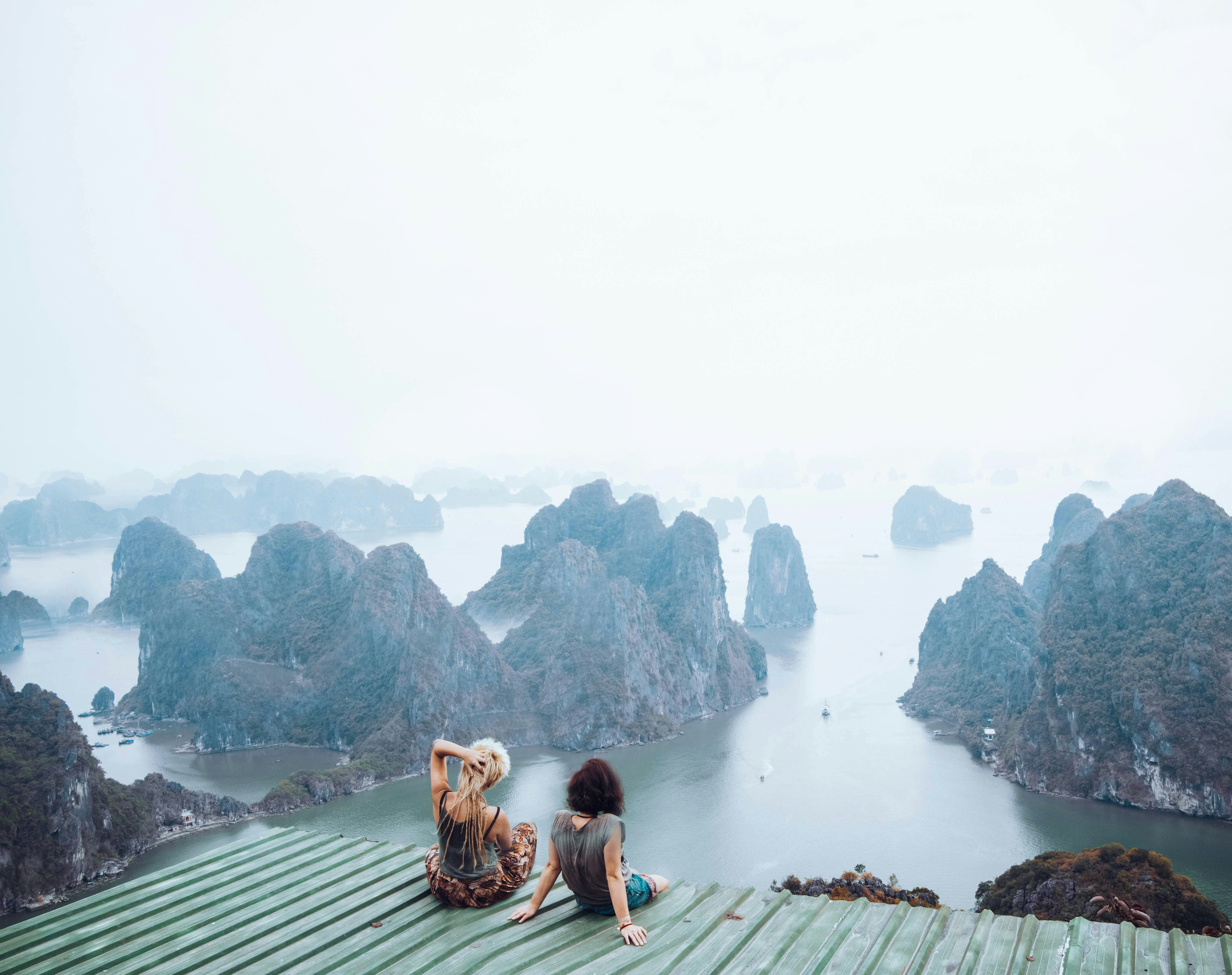 Two women looking down on Halong Bay, Vietnam