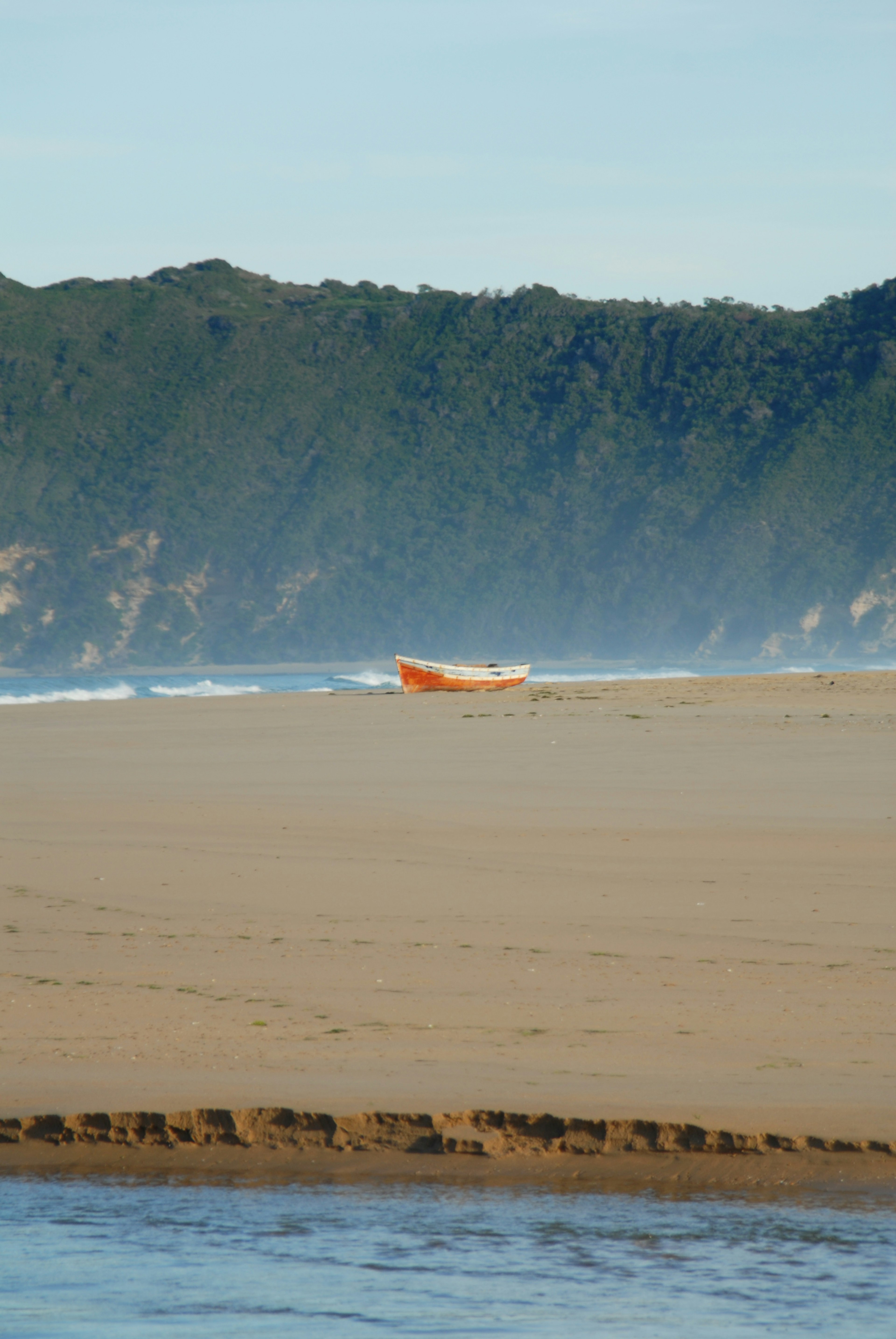 Lonely Beach boat Garden Route scene with river