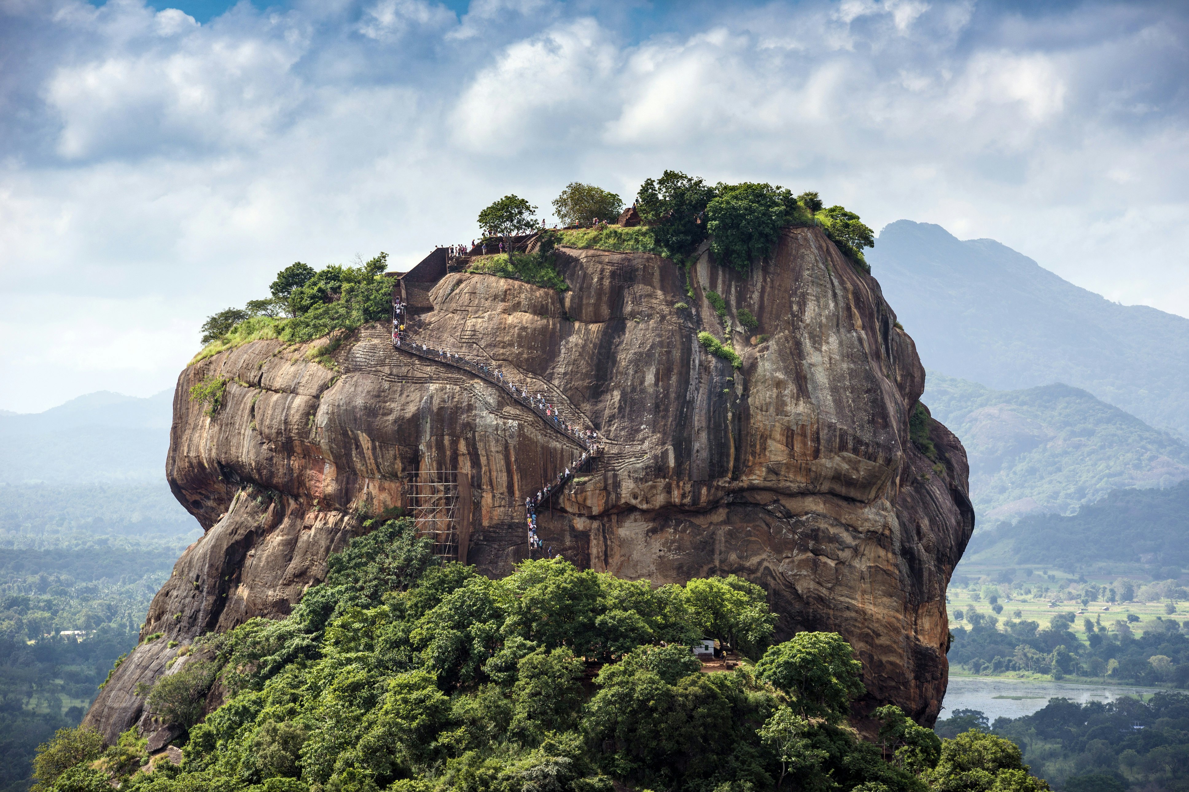 Visitors climb the staircase on Lion rock (Sigiriya).