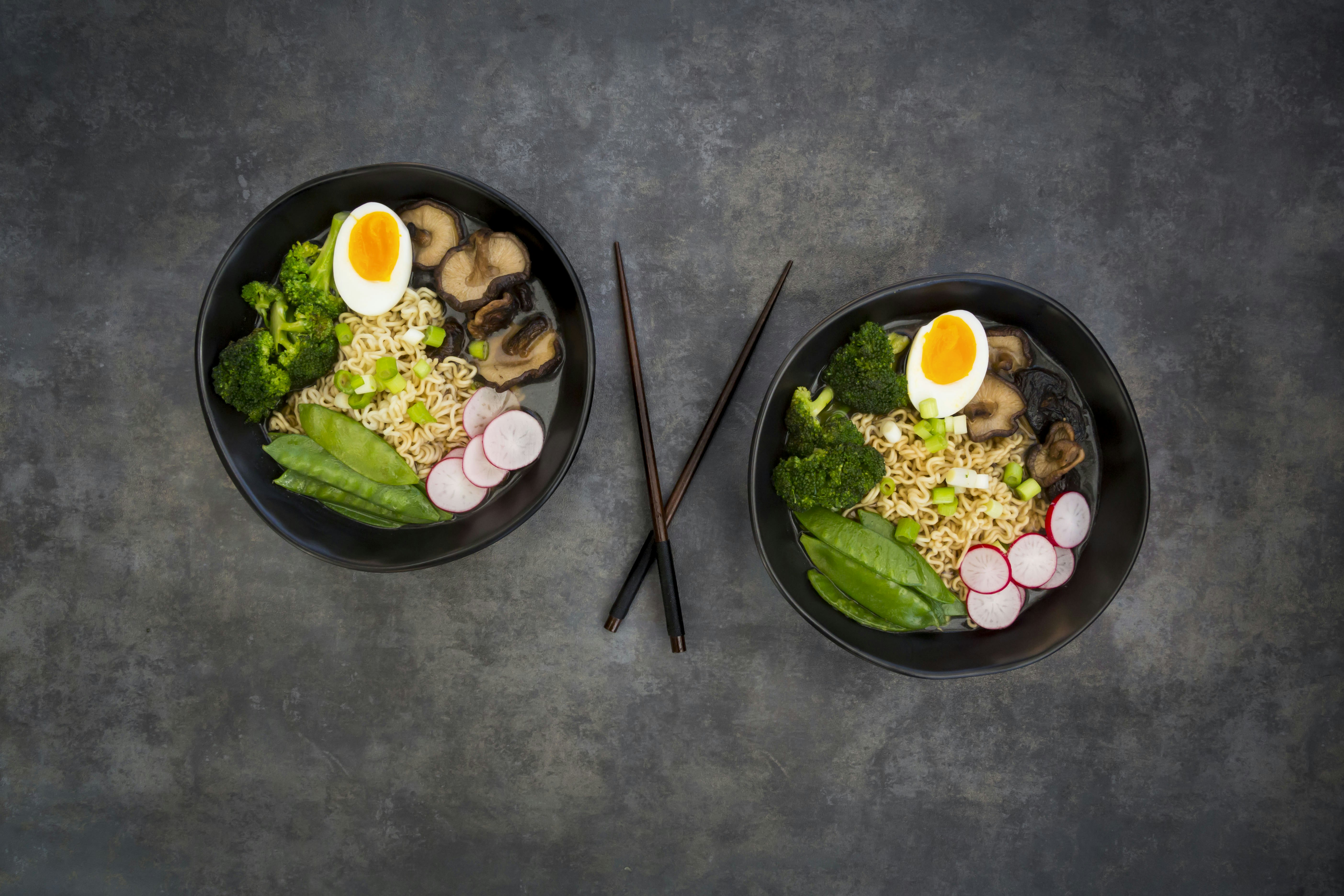 Ramen soup with egg, sugar peas, broccoli, noodles, shitake mushroom and red radish