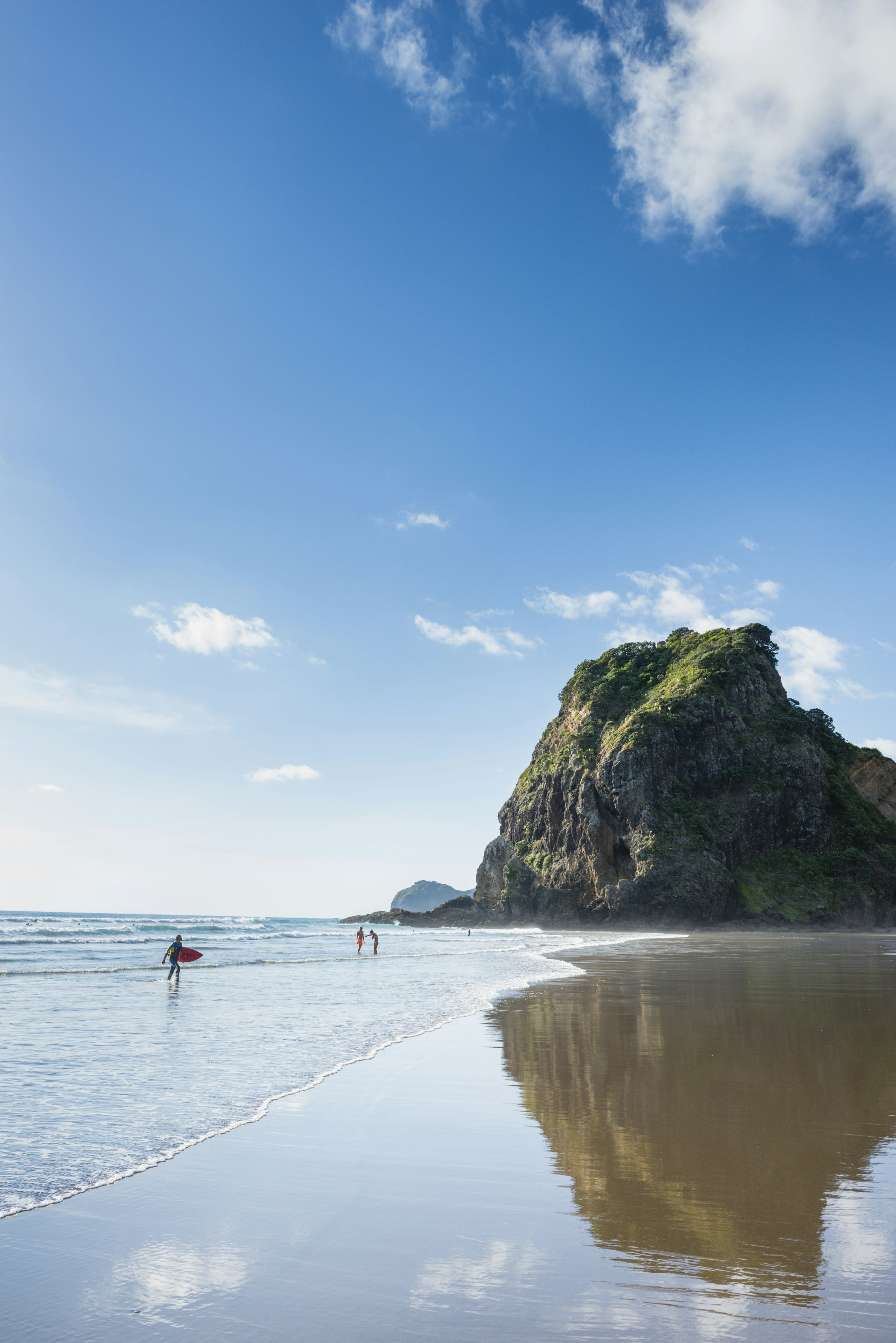 Lion Rock dominates the bay and beach at Piha.